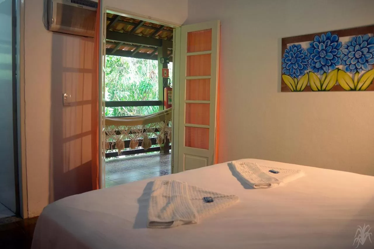 Bed in Pousada Capim Melado