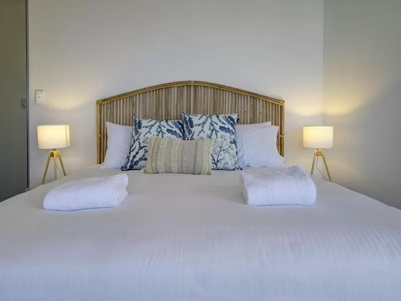 Bed in Sunrise Luxury Apartments