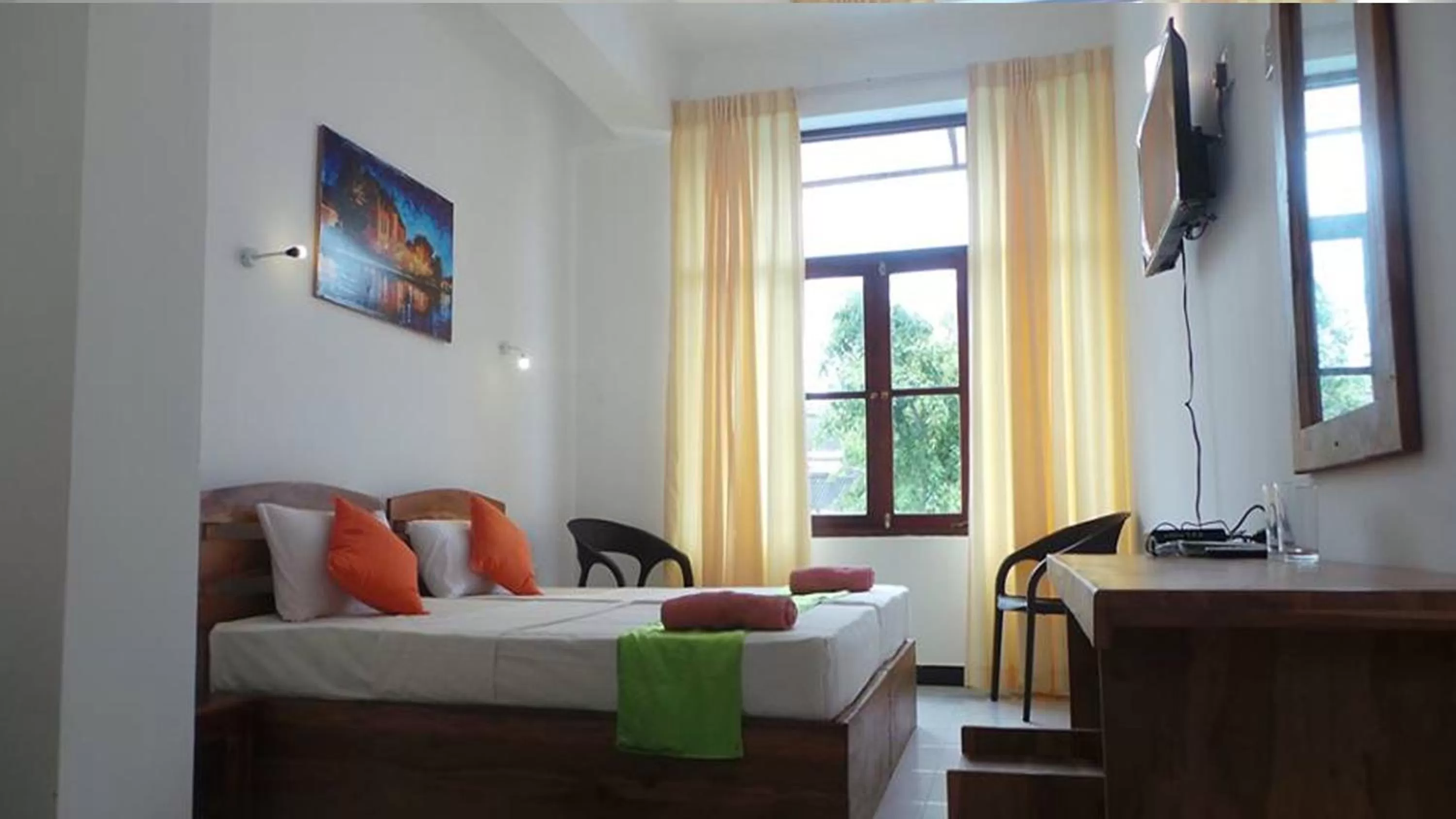 Bed in WindMill Beach Villa and Hotel