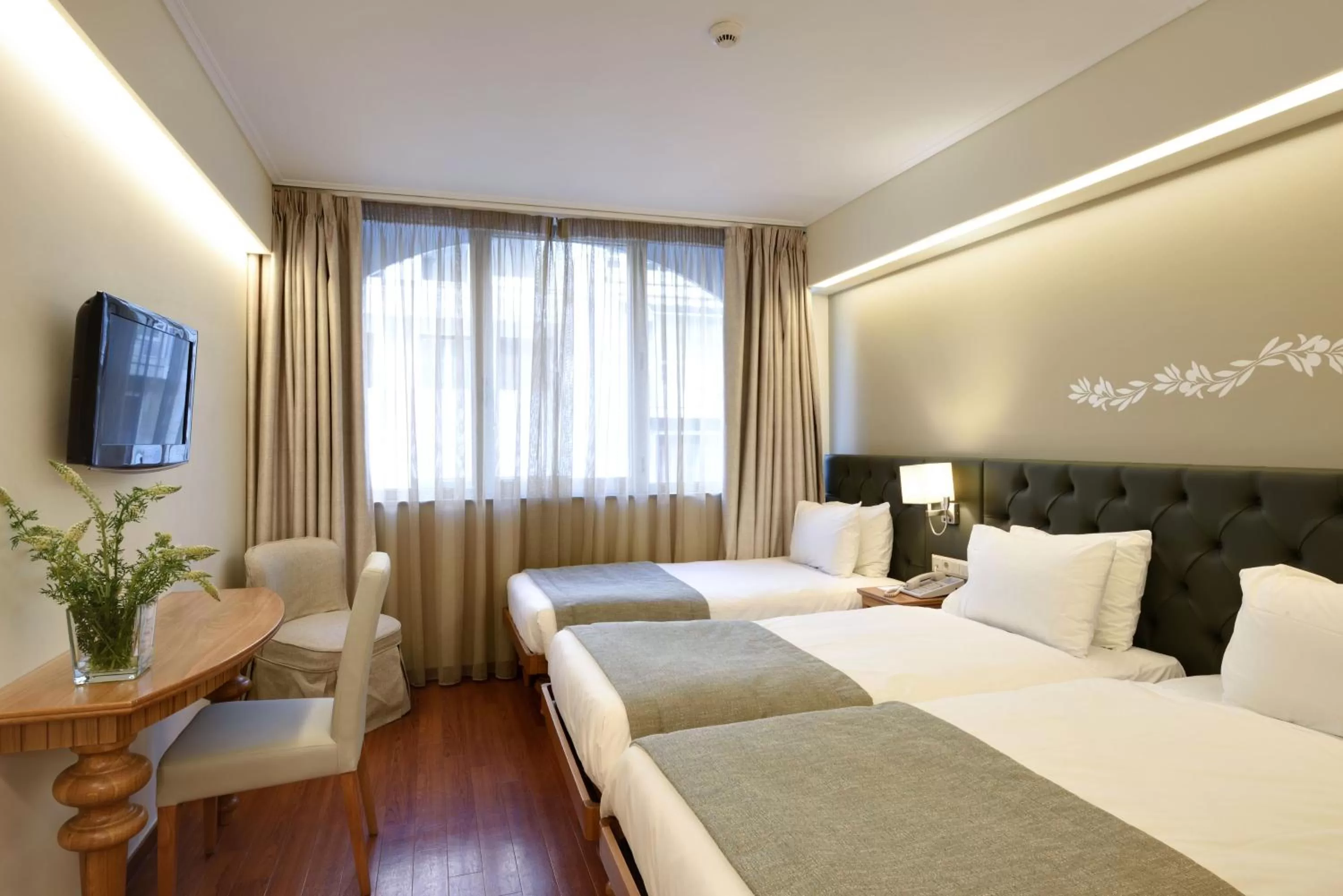 Bed in Titania Hotel