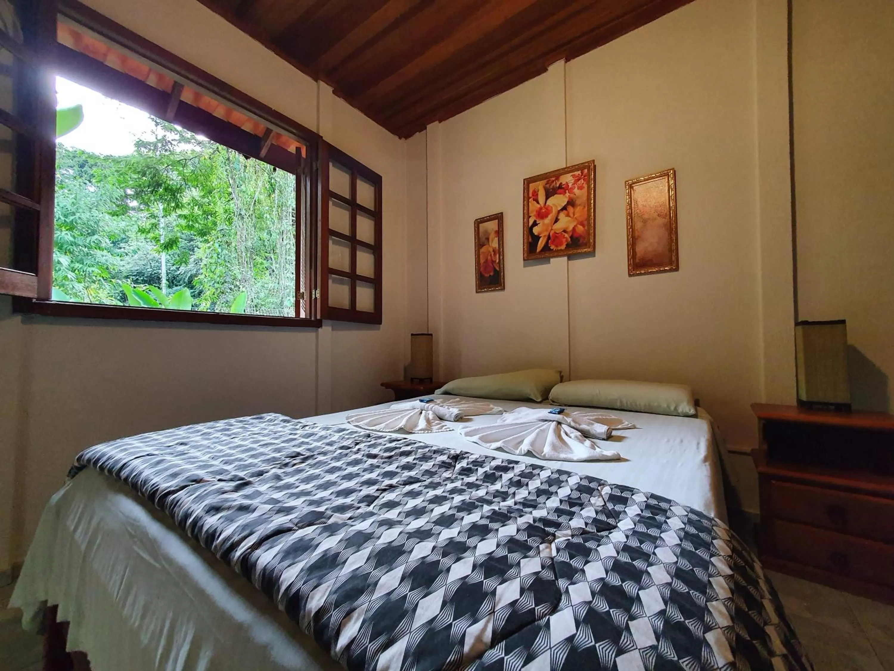 Bed in Pousada Canto do Curió Paraty