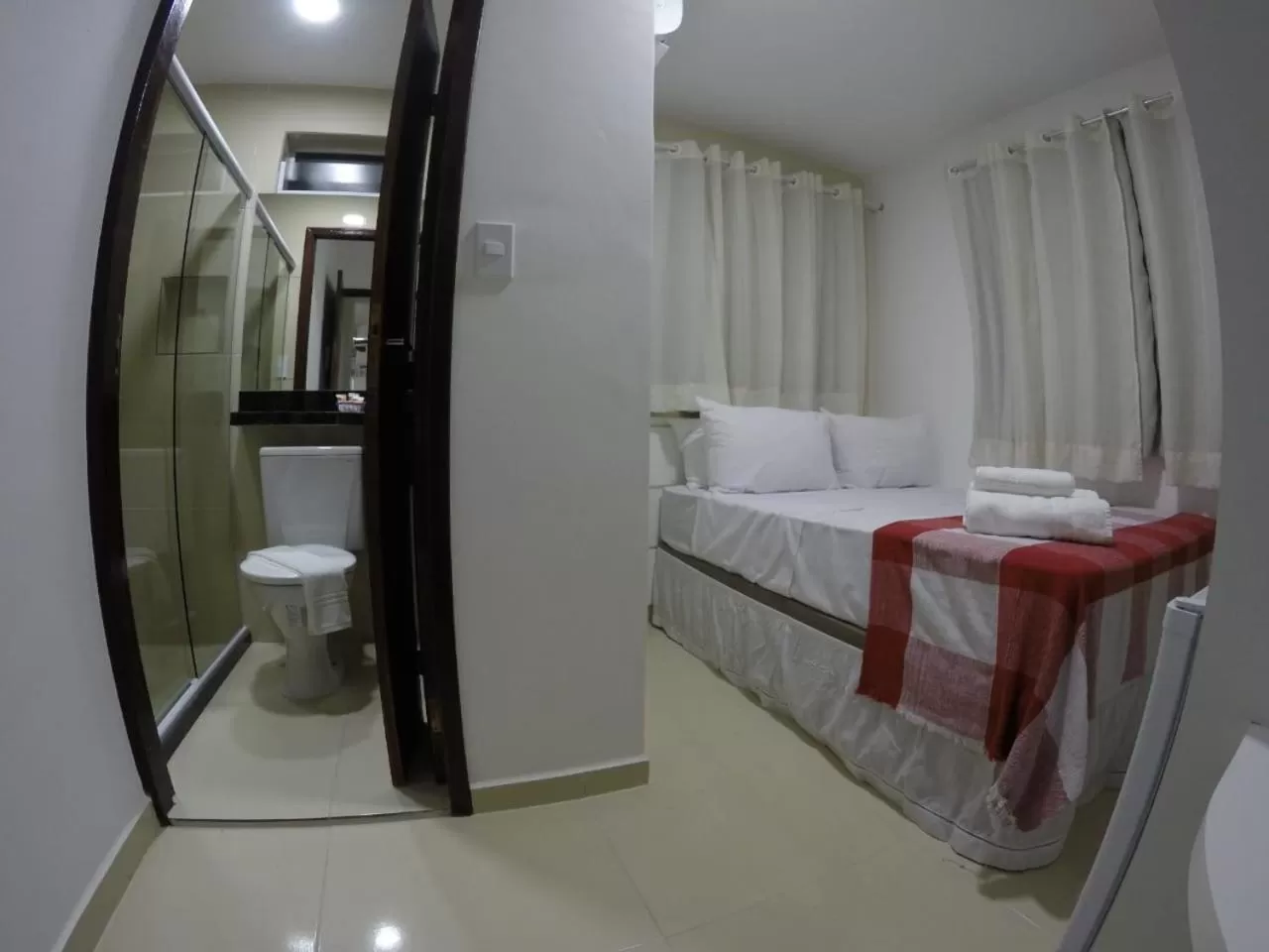 Bed in Pousada Kanoas