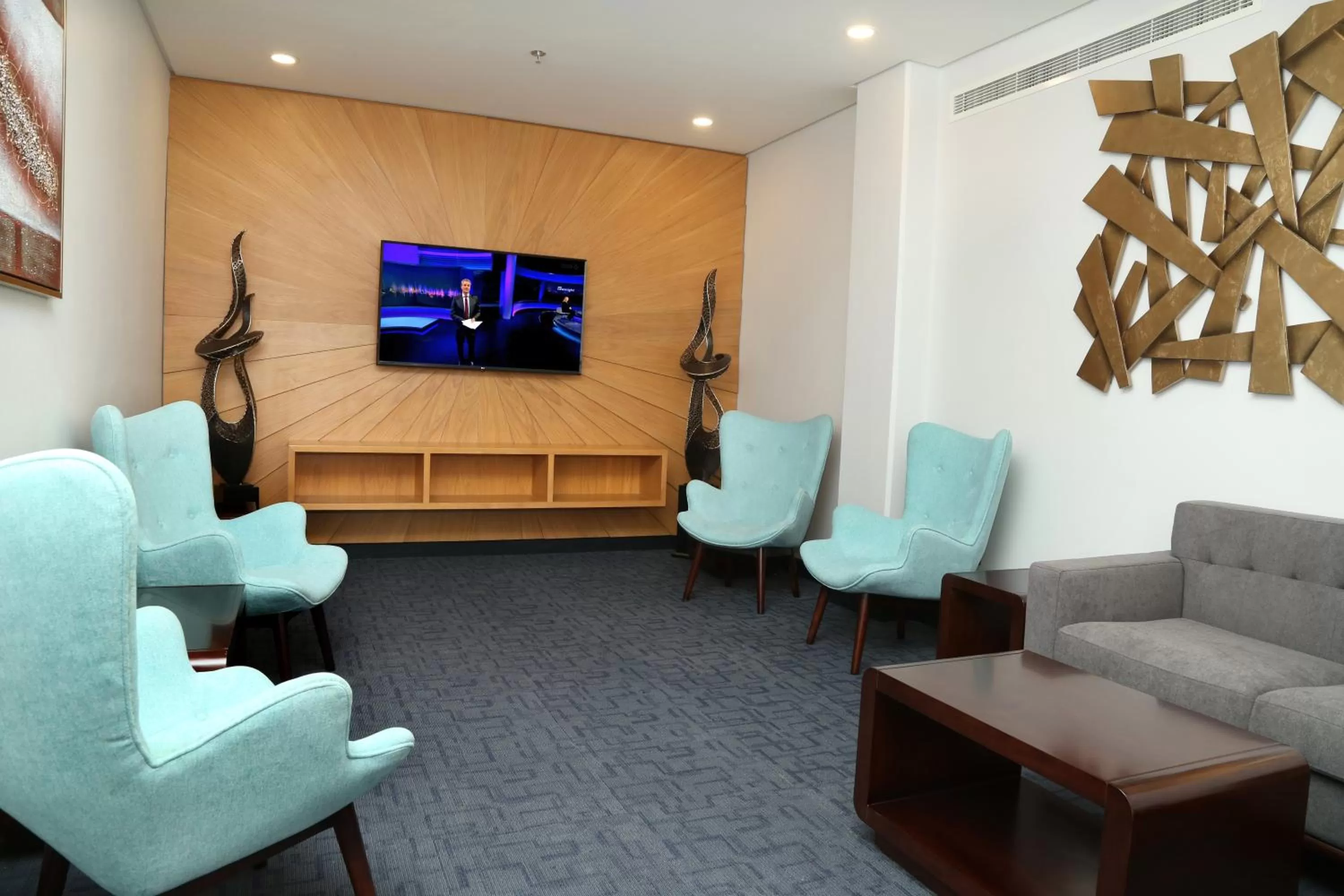 Communal lounge/ TV room in Meshal Hotel