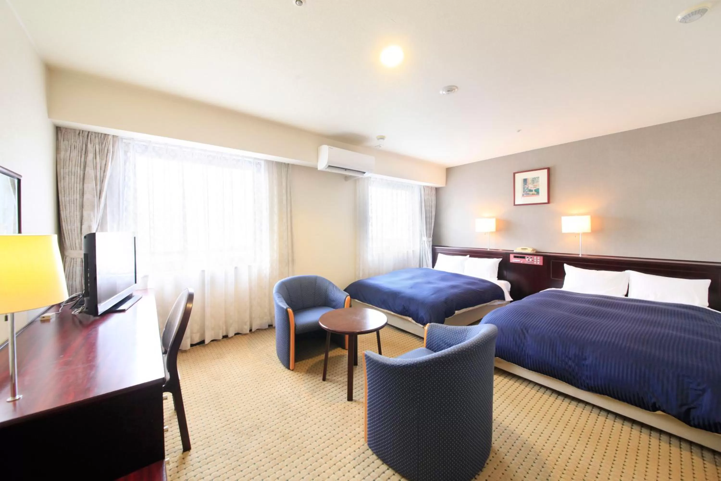 Photo of the whole room, Bed in Quintessa Hotel Ogaki