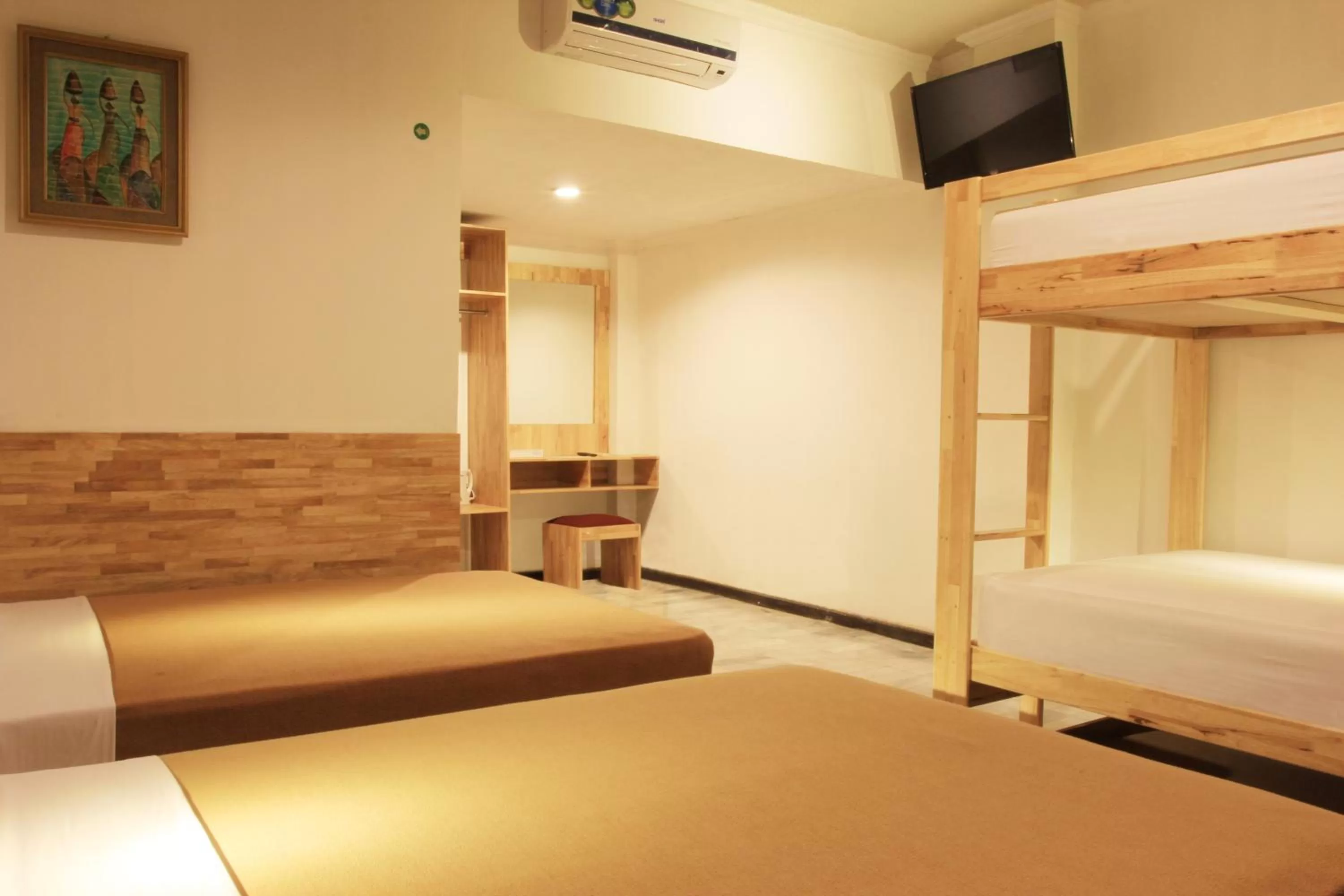 Bed in Hotel Karthi Kuta