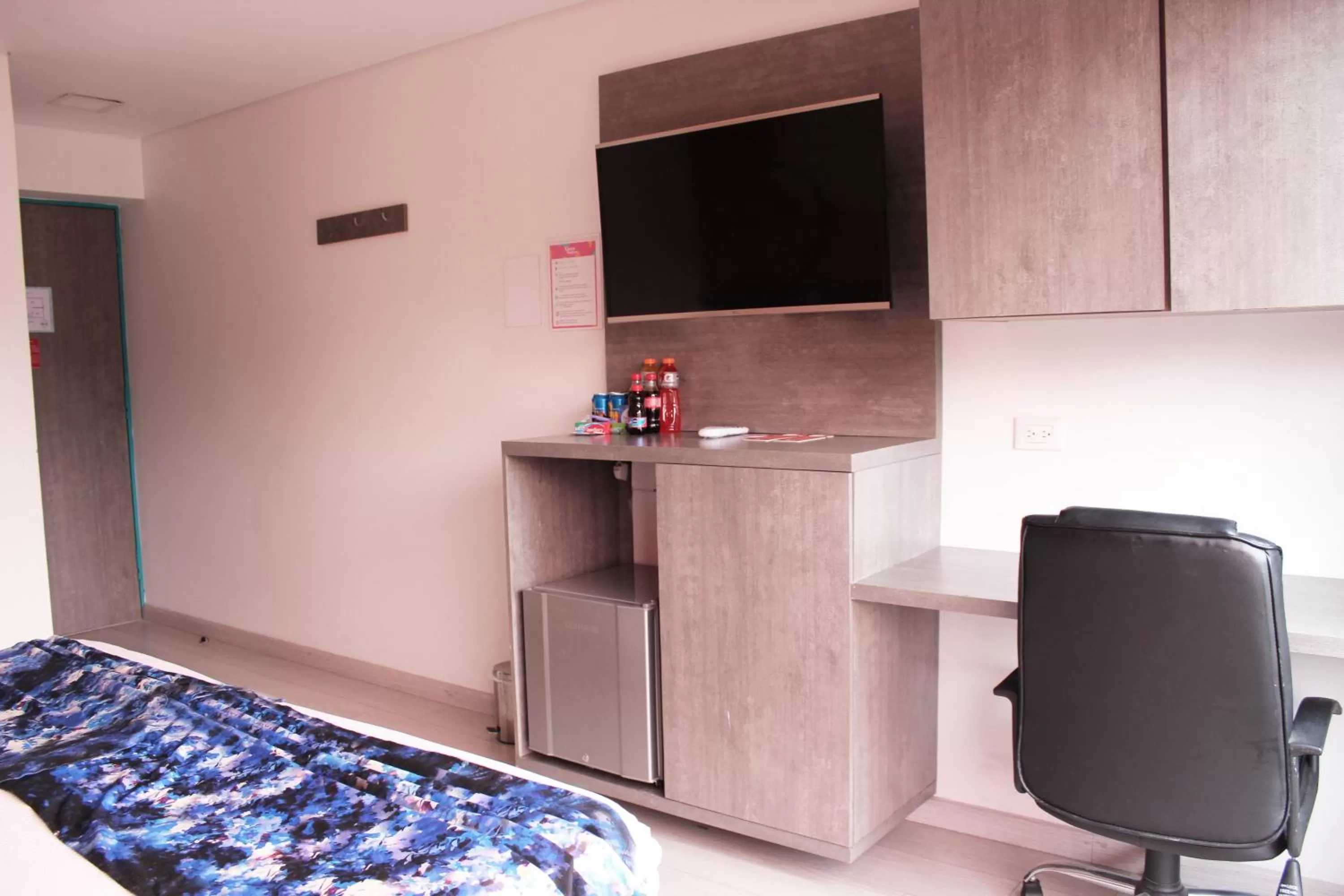 Bed, TV/Entertainment Center in Agora Suites Self-Service Boutique Hotel