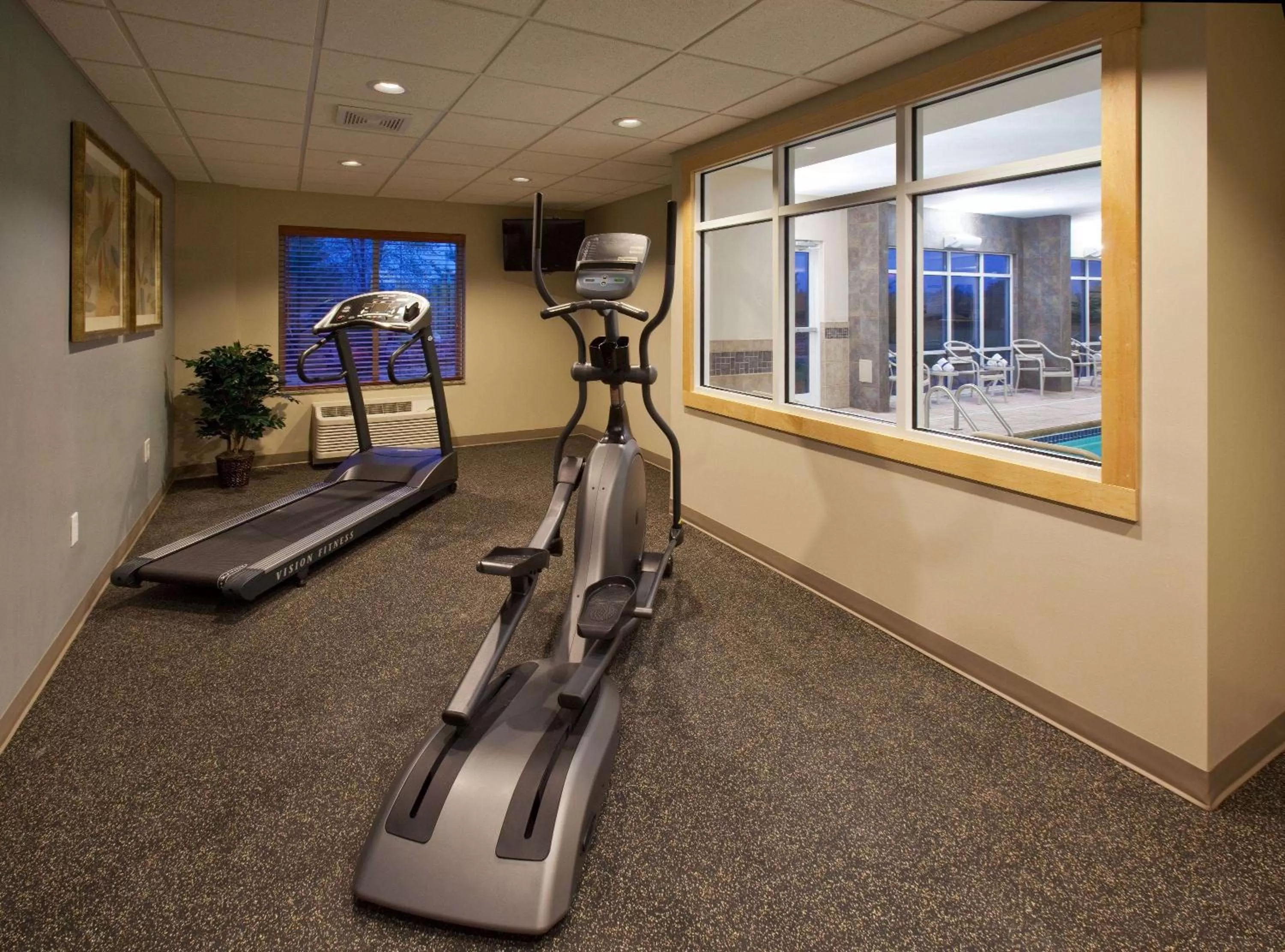 Fitness centre/facilities in AmericInn by Wyndham Fairfield