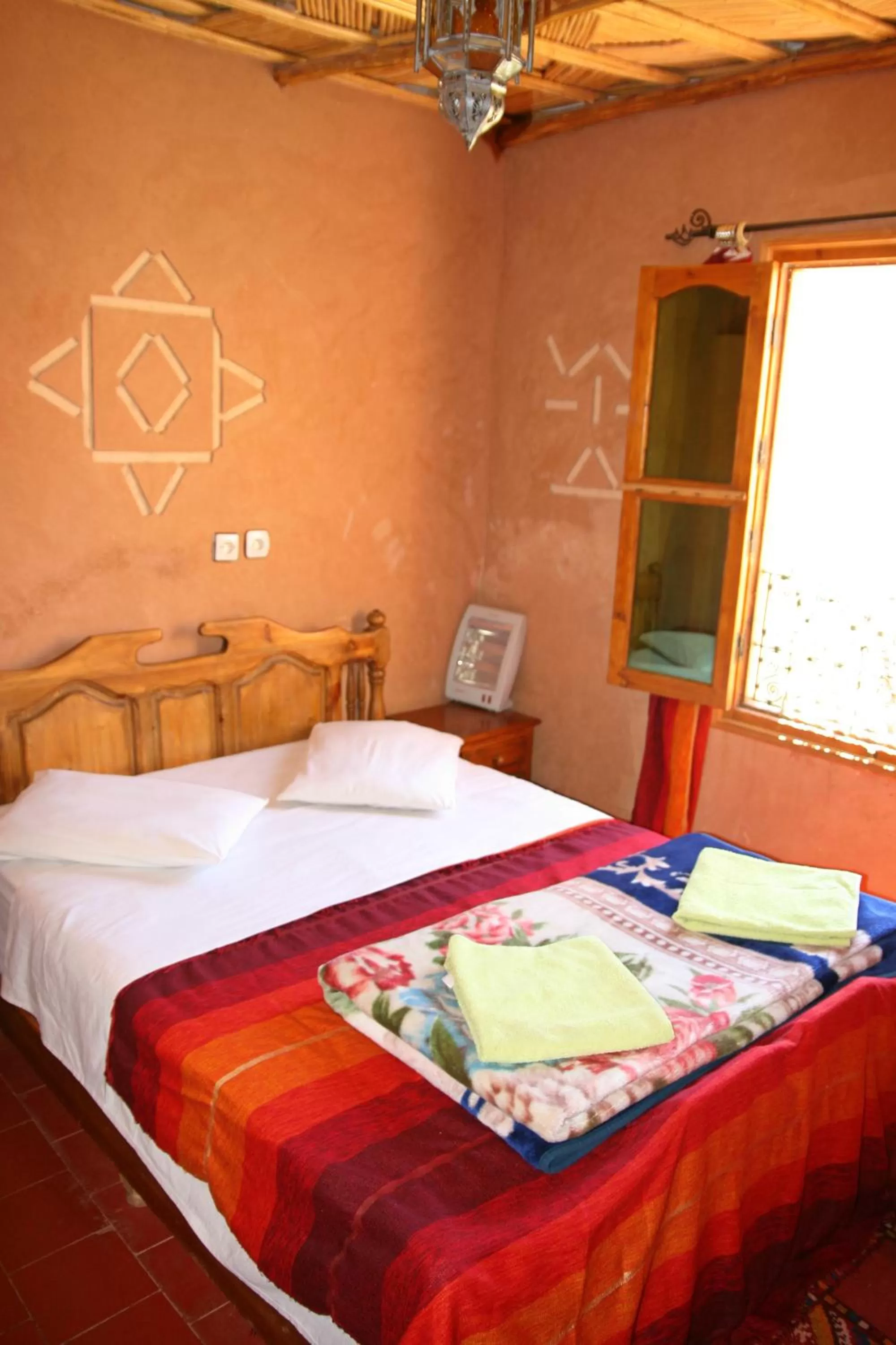 Bed in Maison d'Hôte Valentine