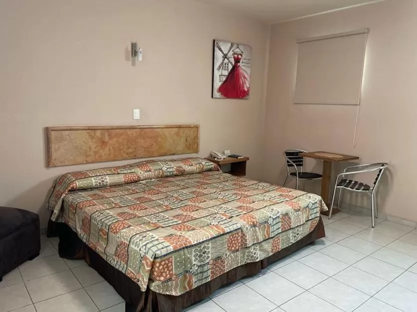 Bed in Hotel Santo Domingo Express