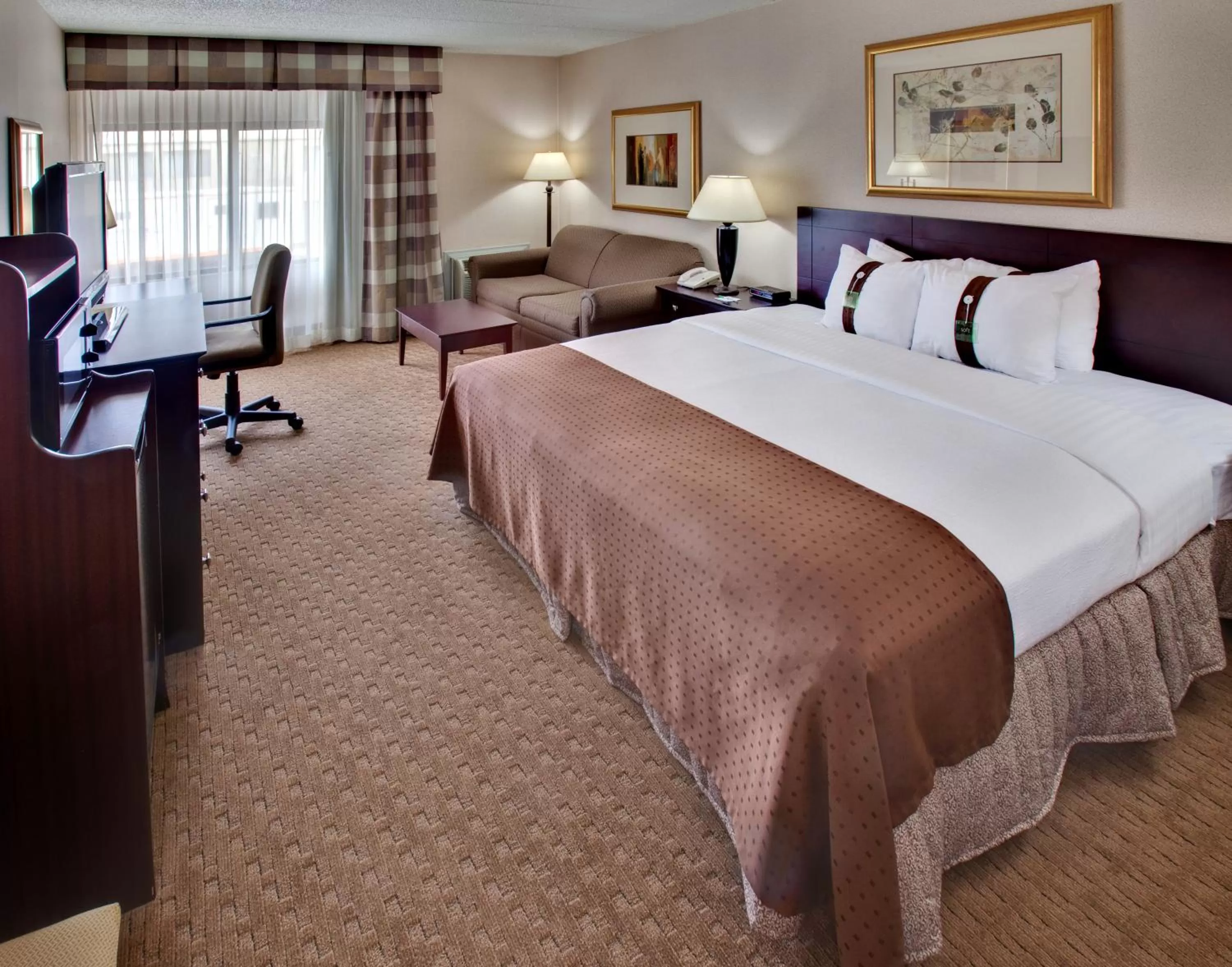 Photo of the whole room, Bed in Ramada by Wyndham Midtown Grand Island
