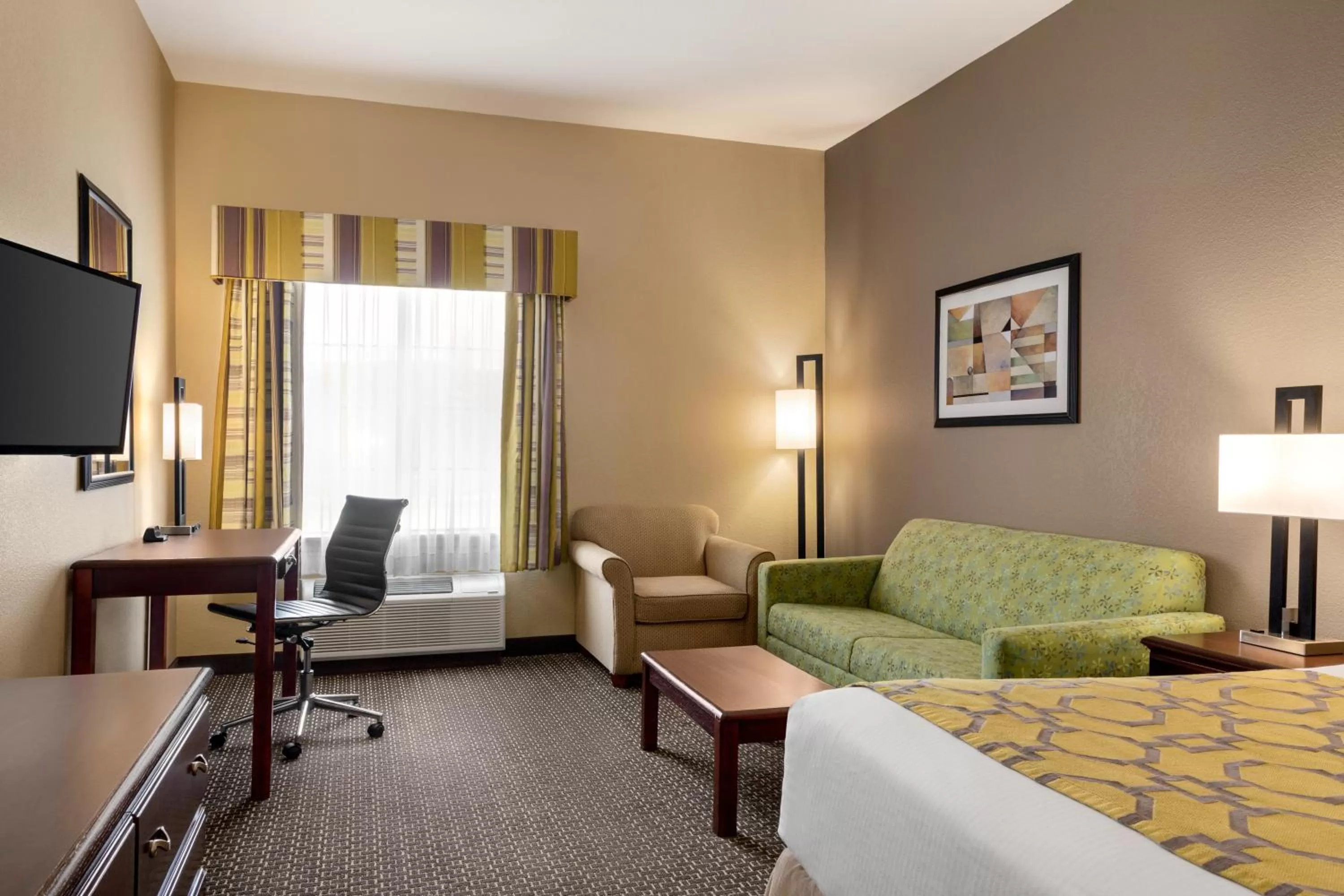 Seating area, Bed in Baymont by Wyndham Wichita Falls