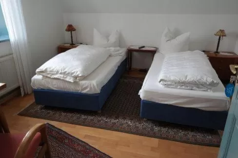 Photo of the whole room, Bed in Gästehaus Howe