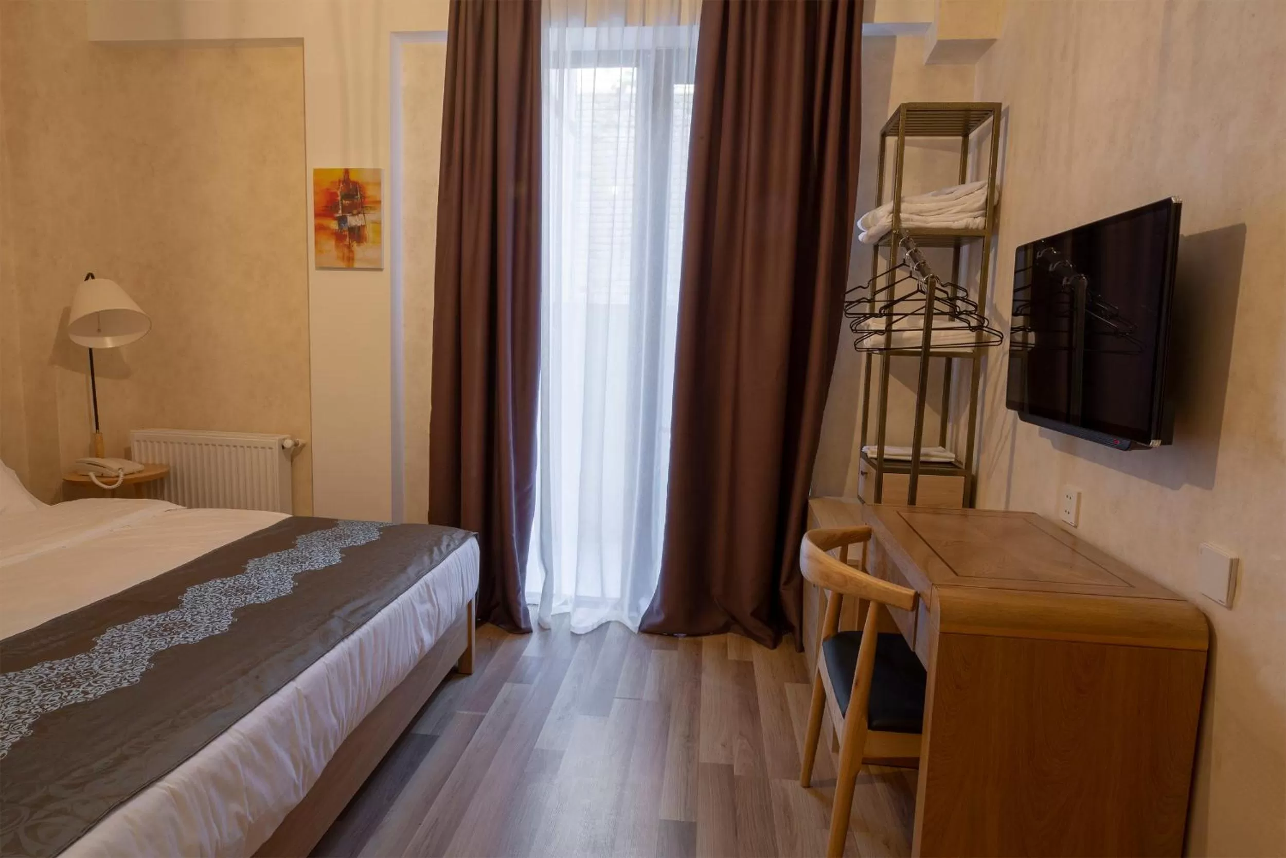 Communal lounge/ TV room, Bed in Ornament Boutique Hotel