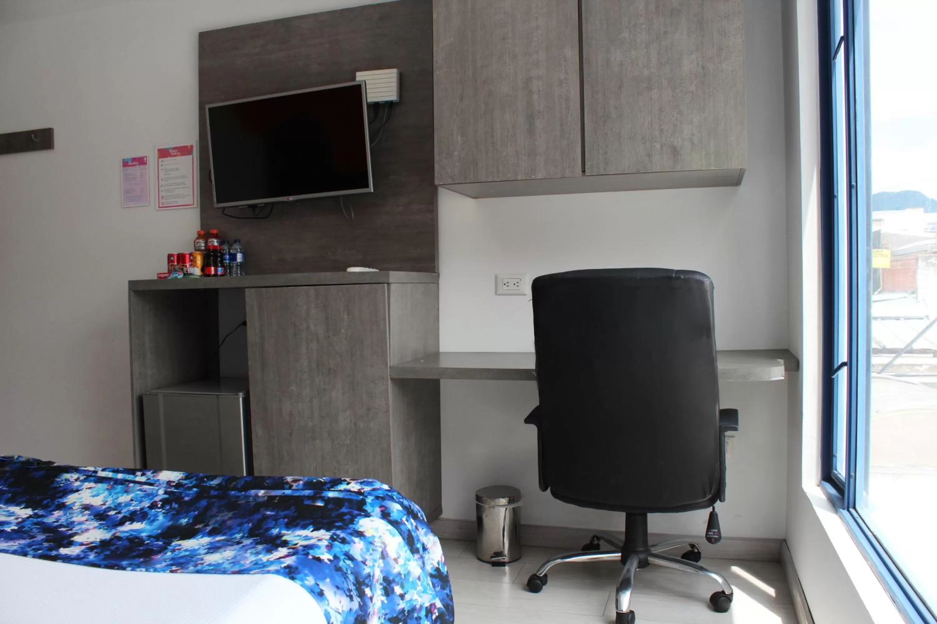 Bed, TV/Entertainment Center in Agora Suites Self-Service Boutique Hotel