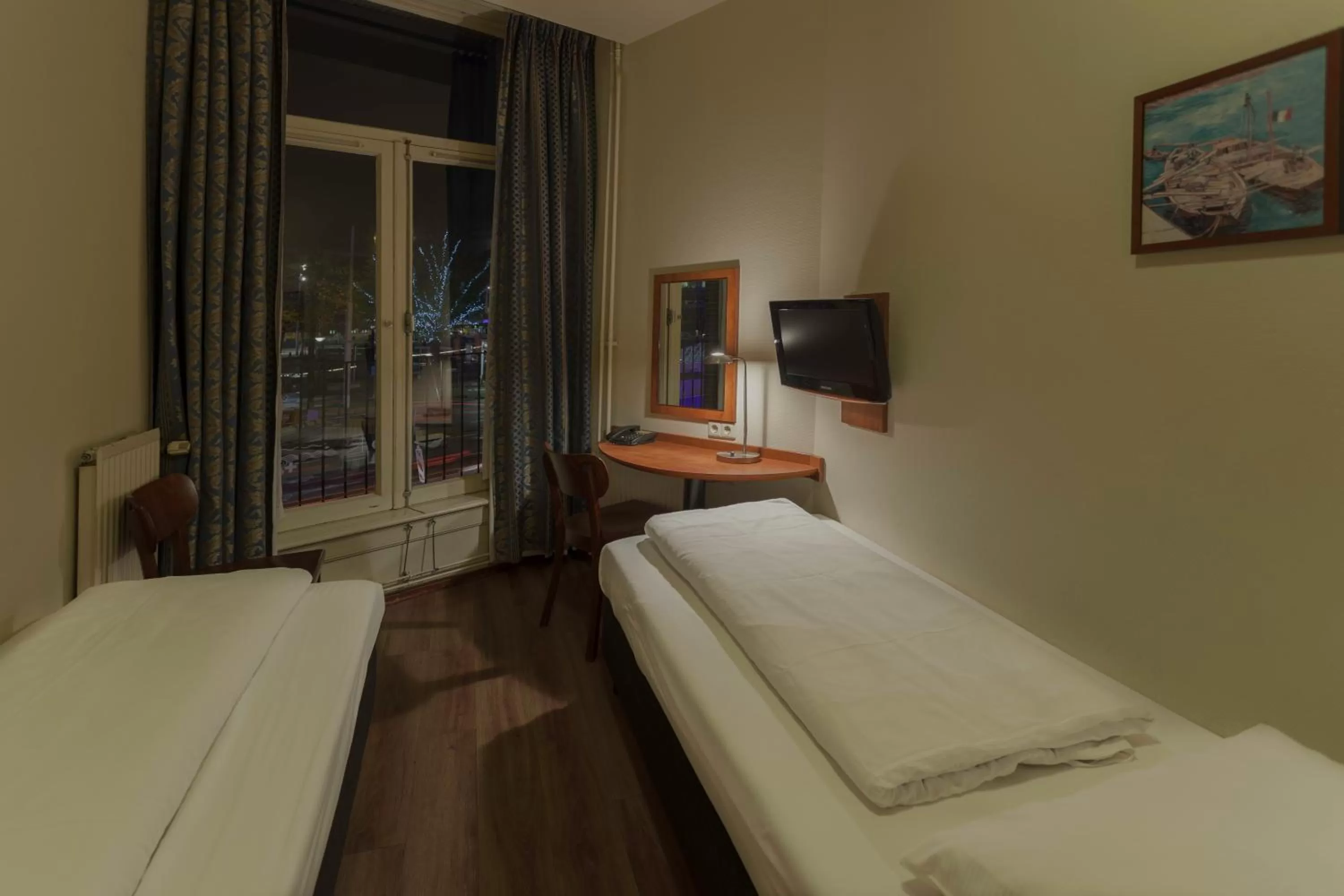 Bed in A-Train Hotel