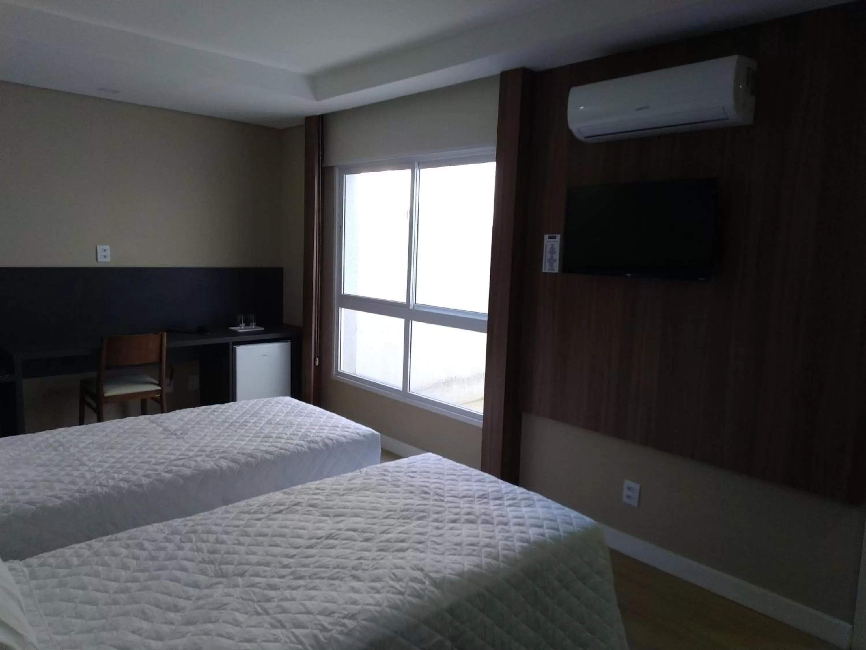 Bed in M Tower Hotel