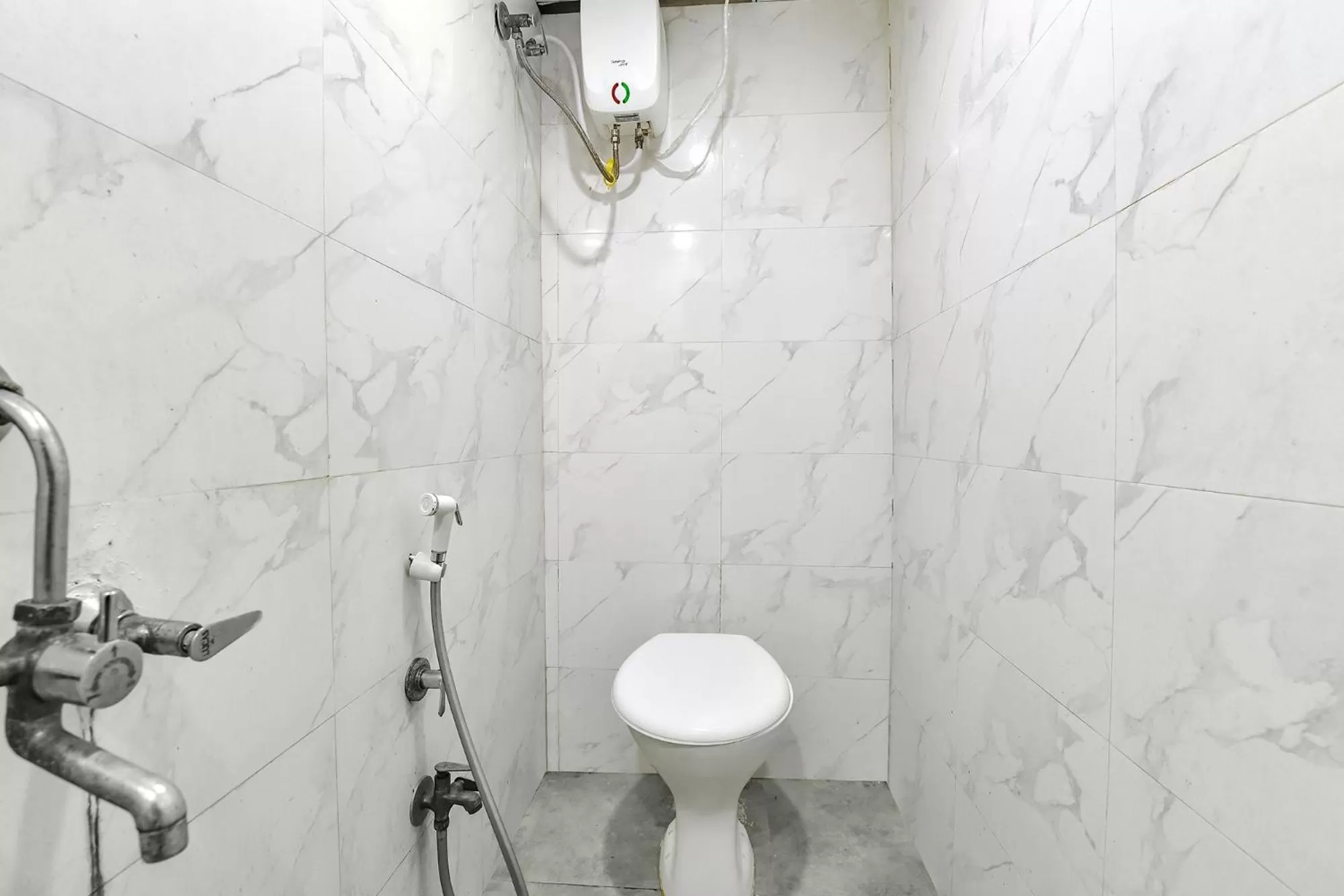 Toilet in FabHotel Nidhivan, Udhna Junction