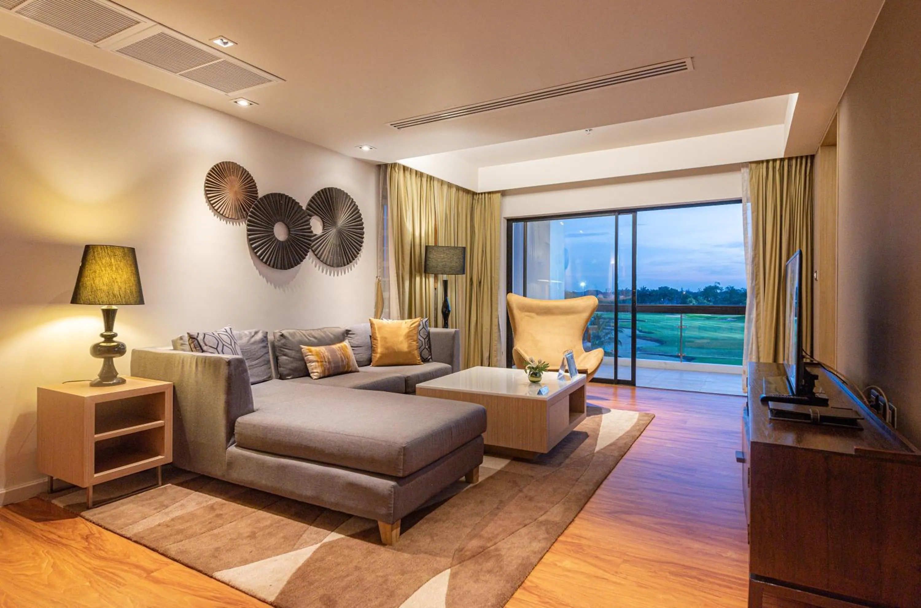 Living room in Summit Windmill Golf Suite Hotel at Suvarnabhumi