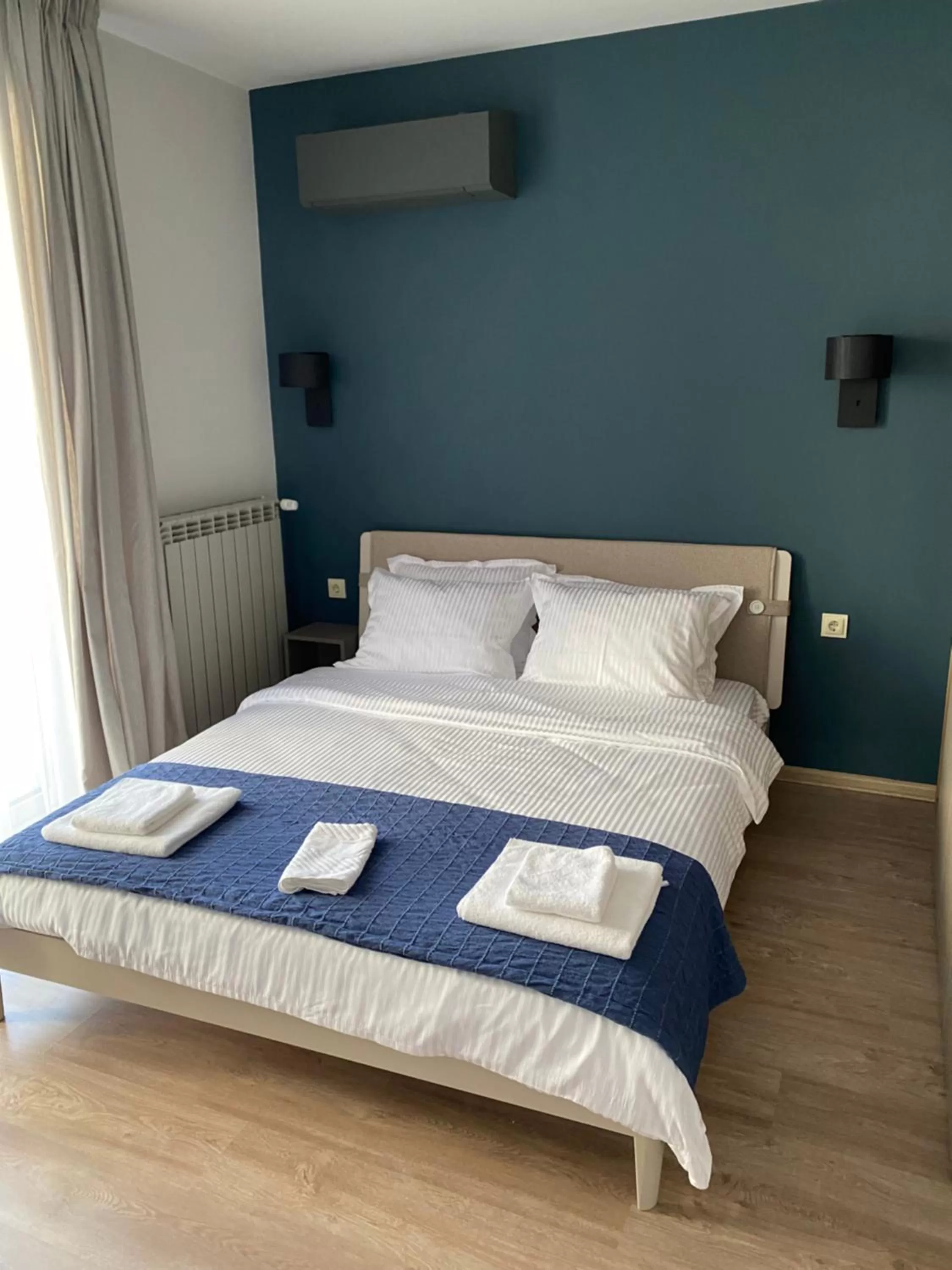 Bed in 7th Sense boutique apartments