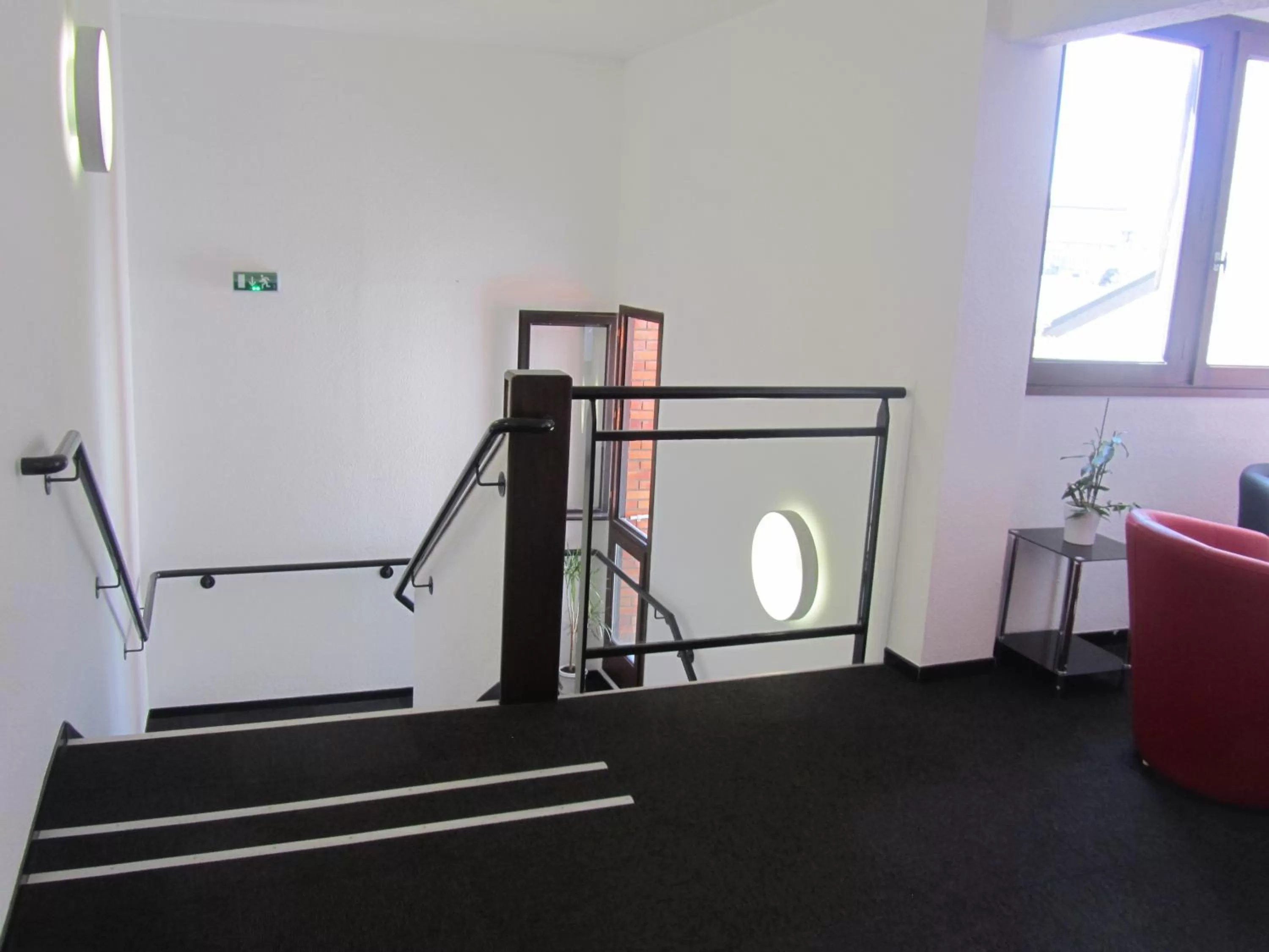 Communal lounge/ TV room in Hôtel Le Saint Joseph