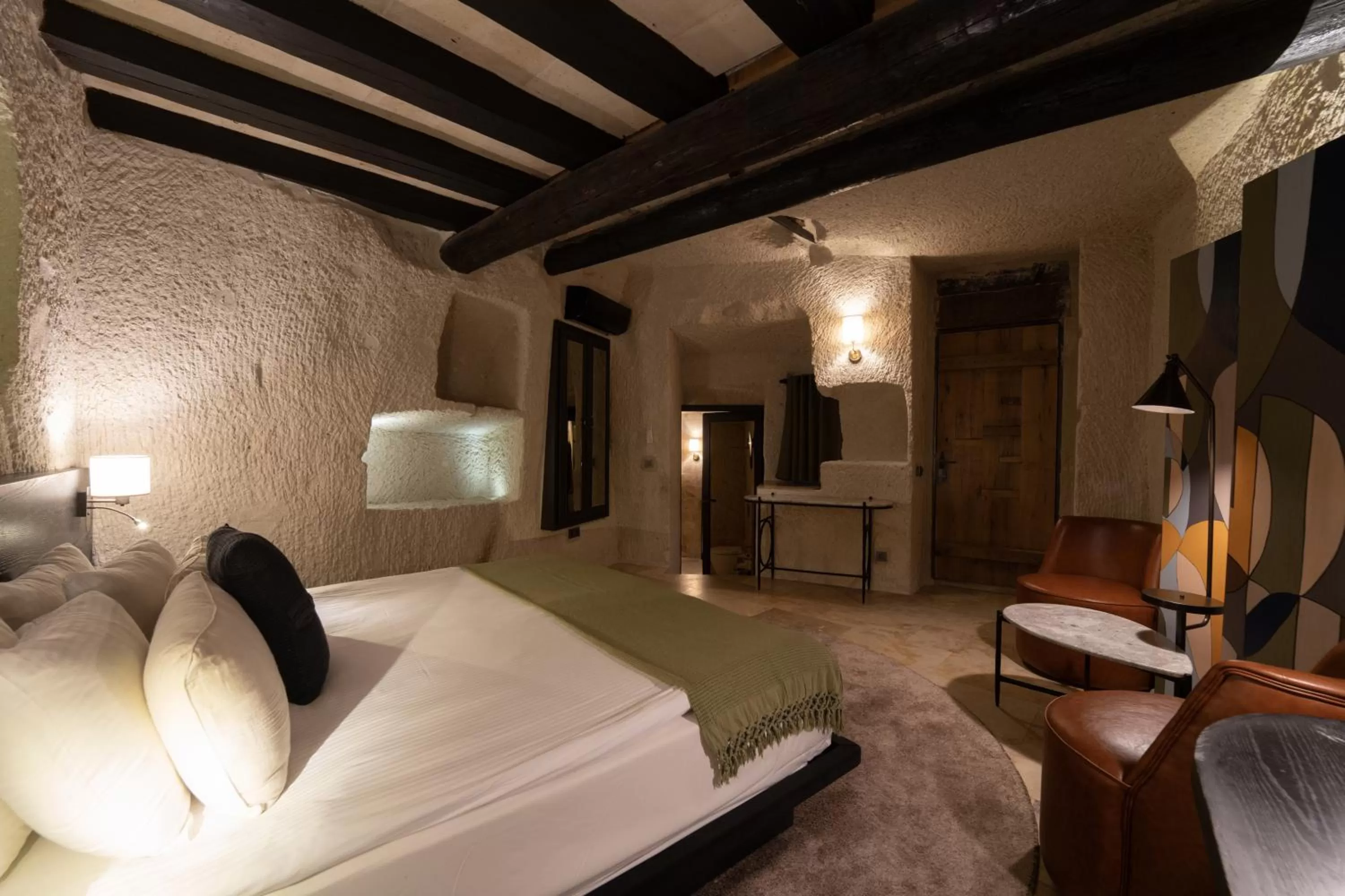 Bedroom, Bed in Artemis Cave Suites & Spa- Adults Only
