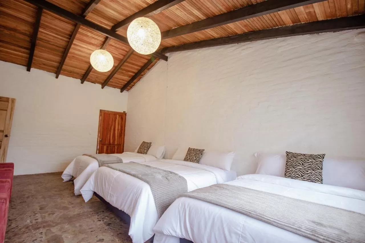 Bed in Rústic Hotel Quinta La Aurora