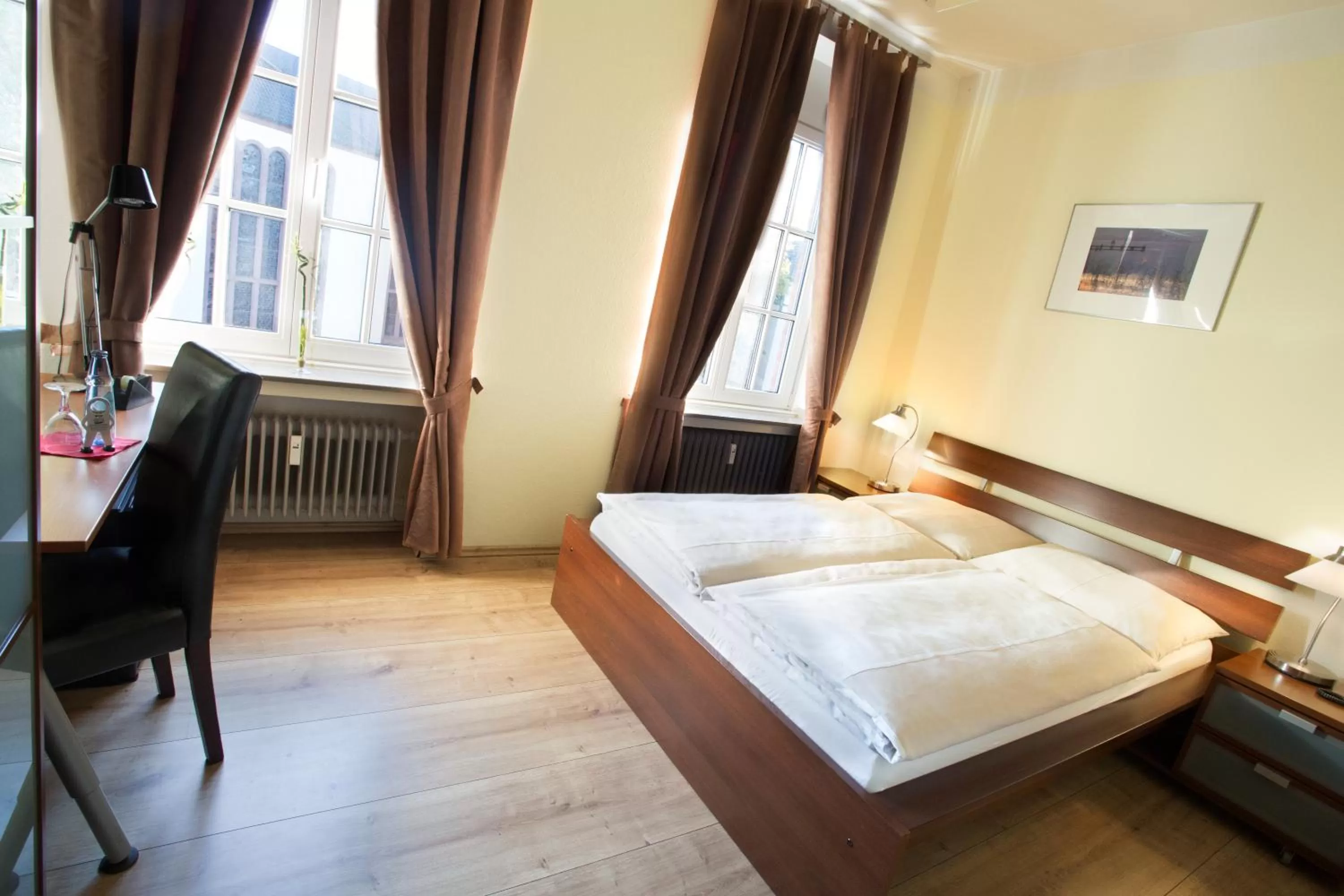 Photo of the whole room, Bed in Stadthotel Jülich