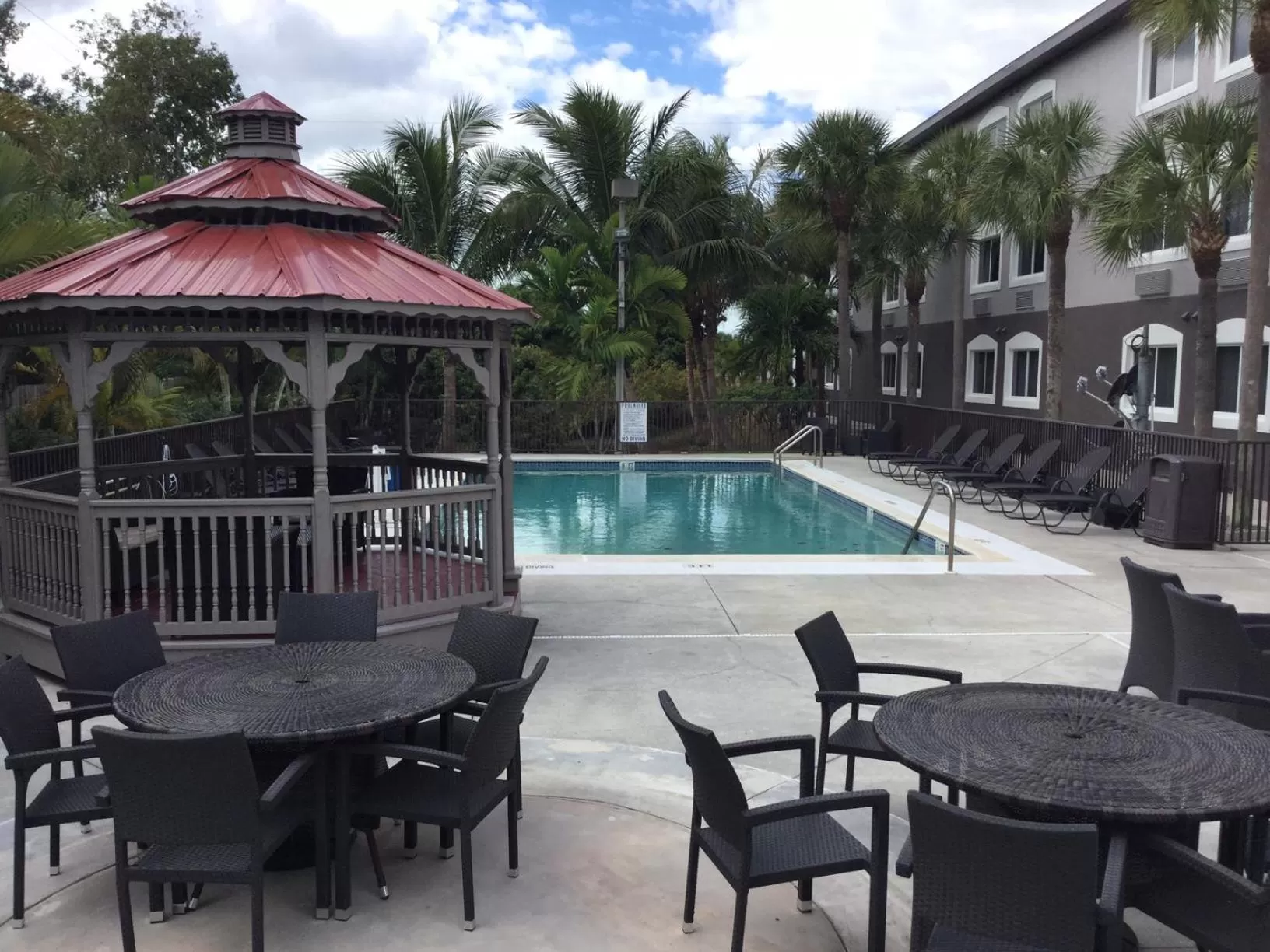 Swimming pool in Days Inn & Suites by Wyndham Bonita Springs North Naples