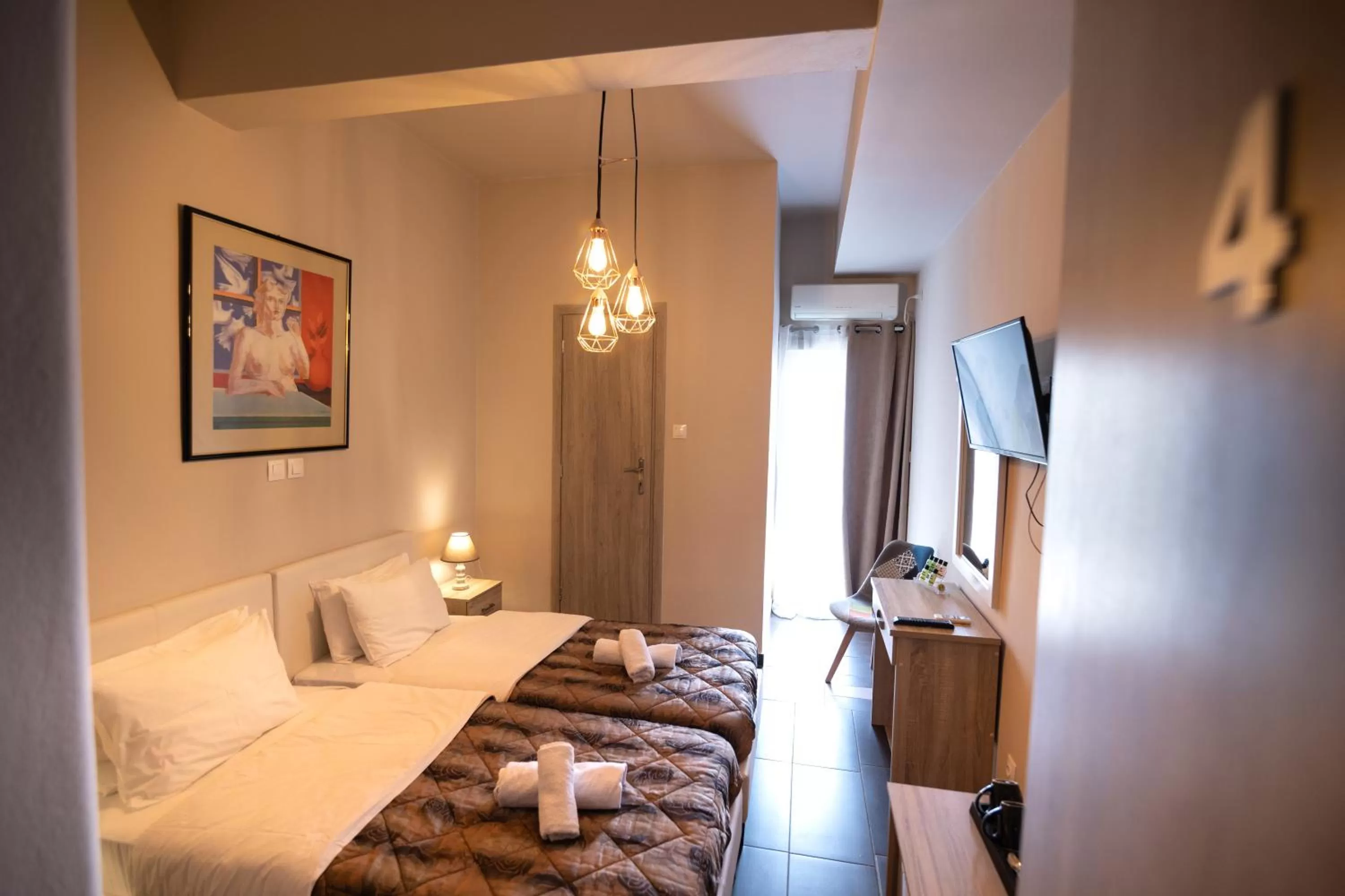 Bed in Votsalakia Hotel & Luxury Apartments