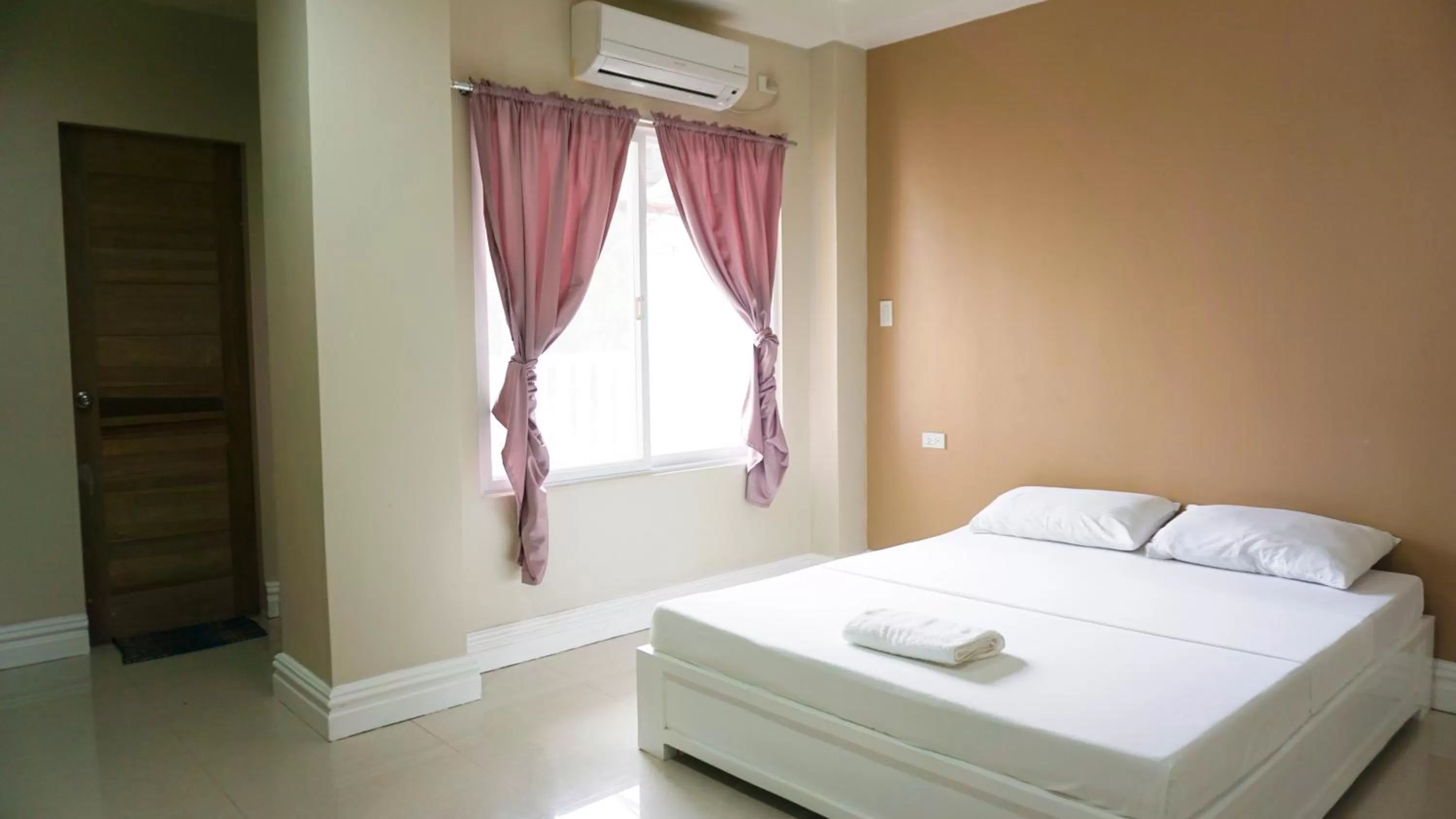 Bed in Sandscape Hotel