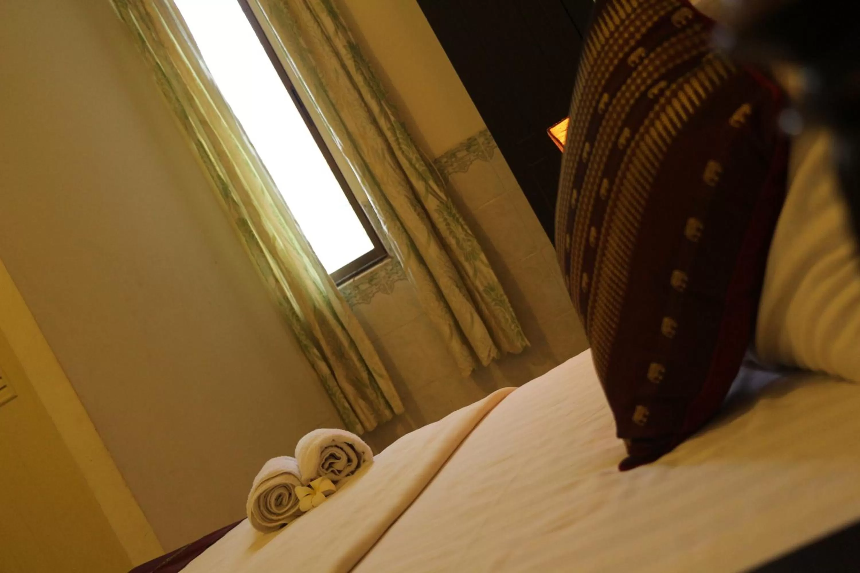 Bed in New Season Riverside Hotel