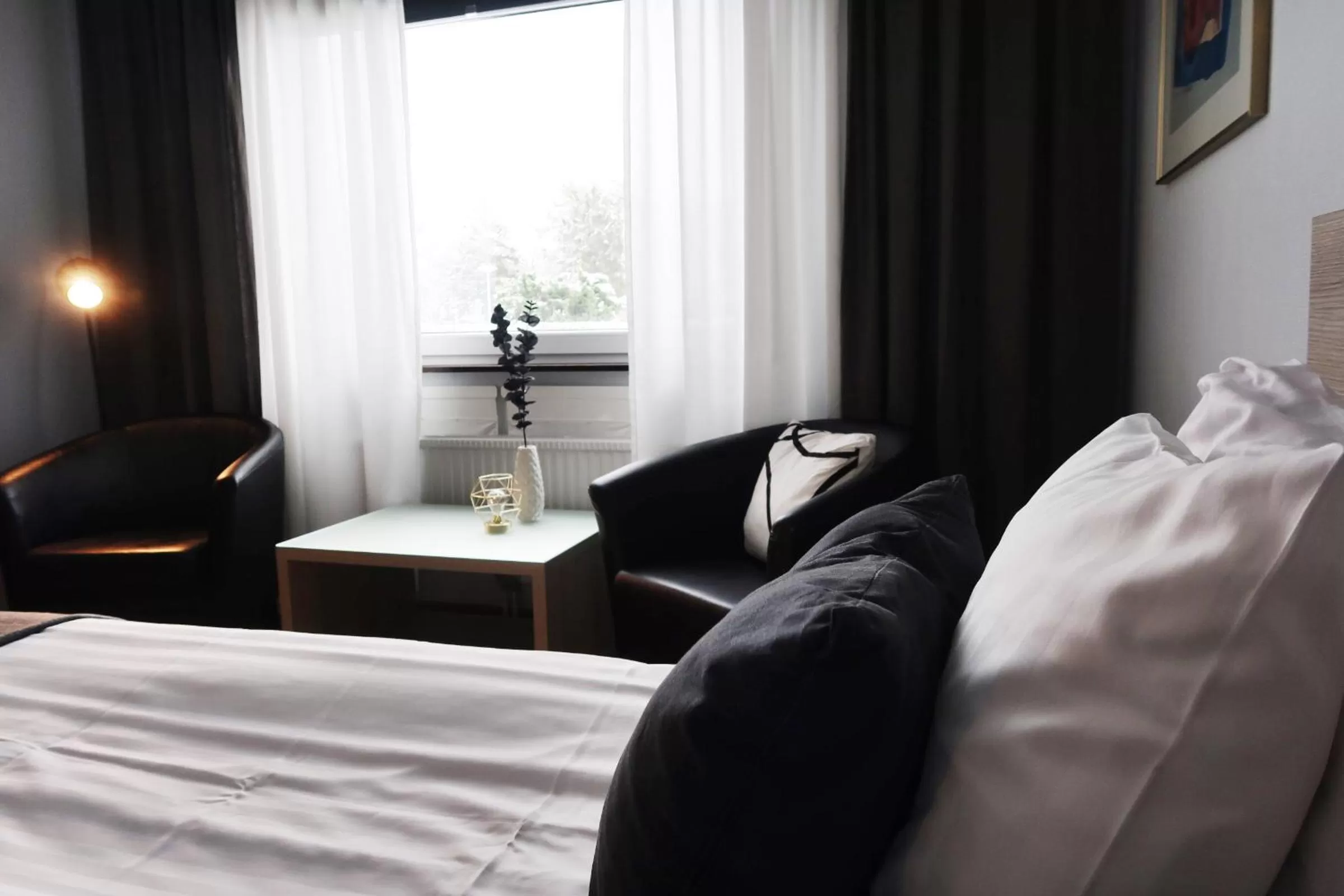 Seating area, Bed in Optima Hotel Roslagen by Reikartz