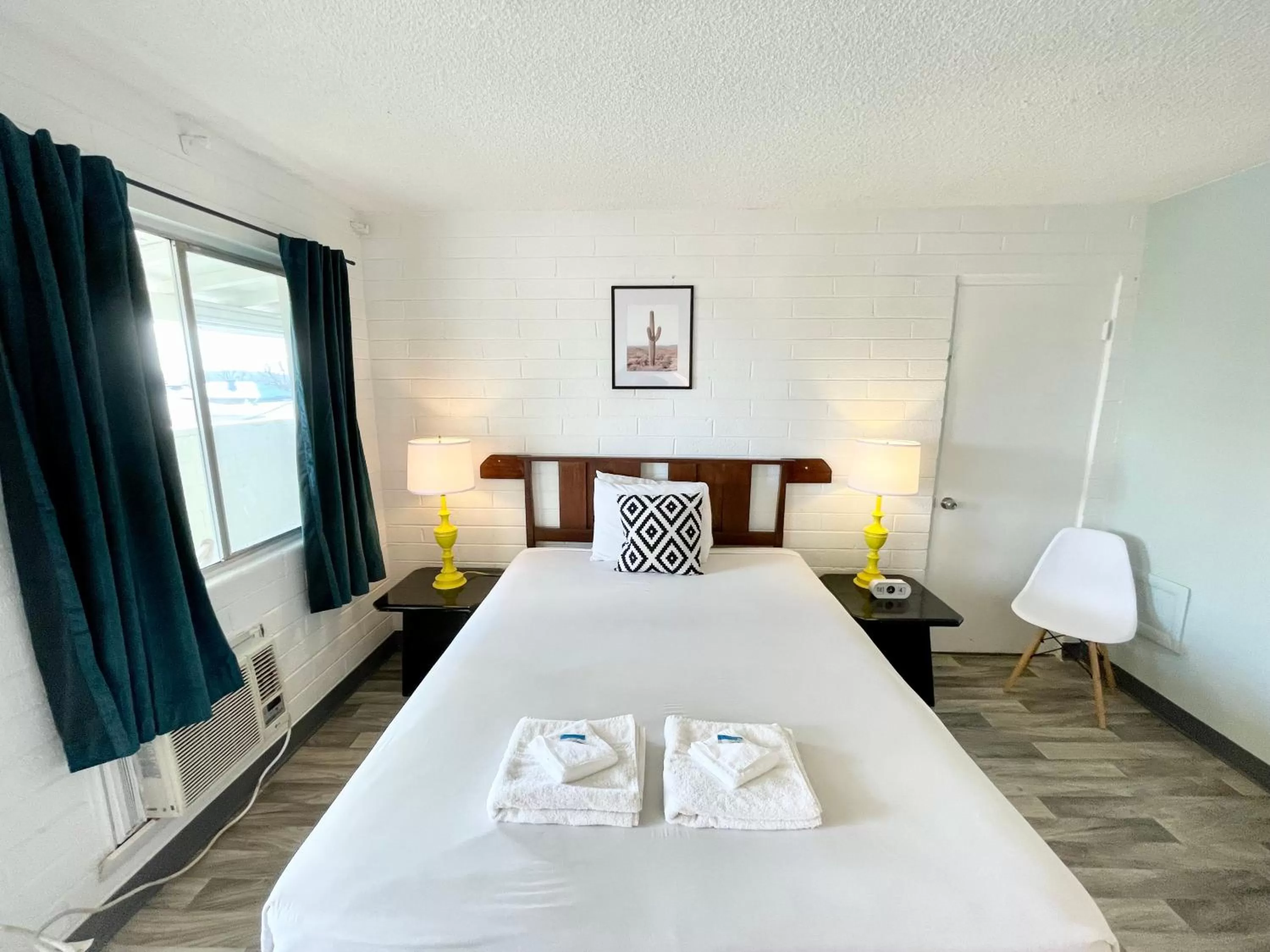 Bed in The Postcard Motel