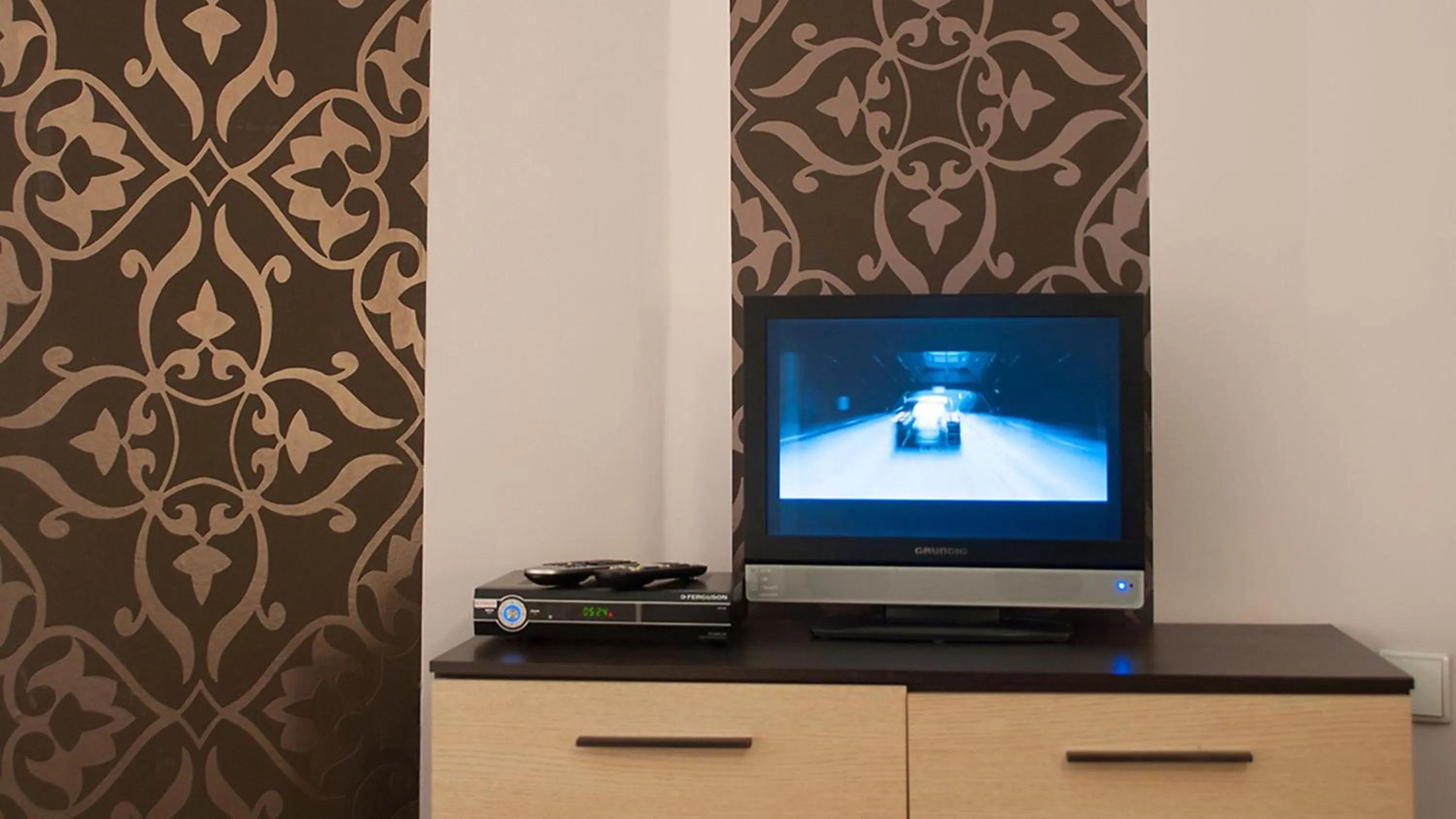 TV and multimedia in Hostel Helvetia Rooms Warsaw CITY CENTER and OLD TOWN