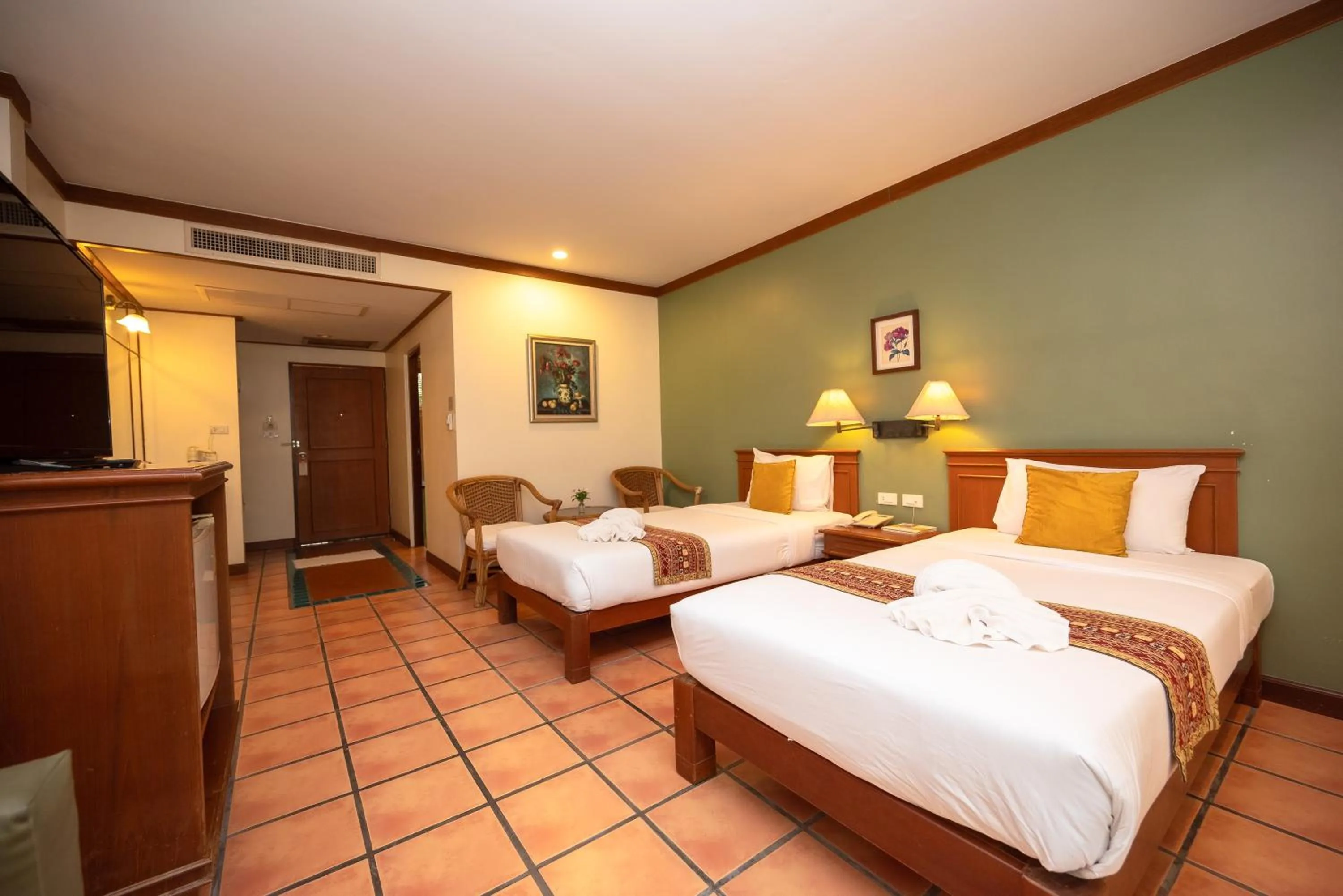 Bed in Comsaed River Kwai Resort