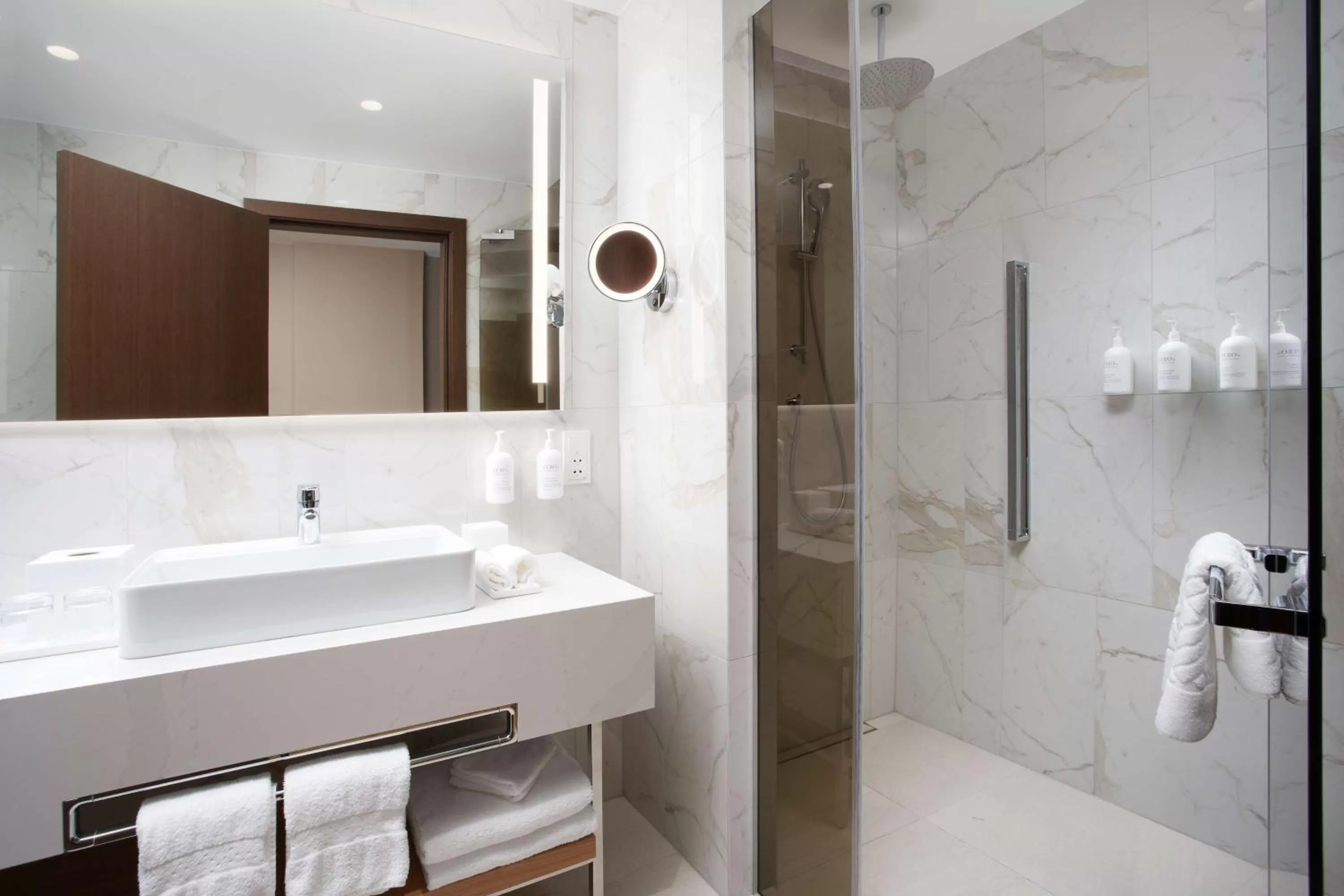 Bathroom in Iceland Parliament Hotel, Curio Collection By Hilton