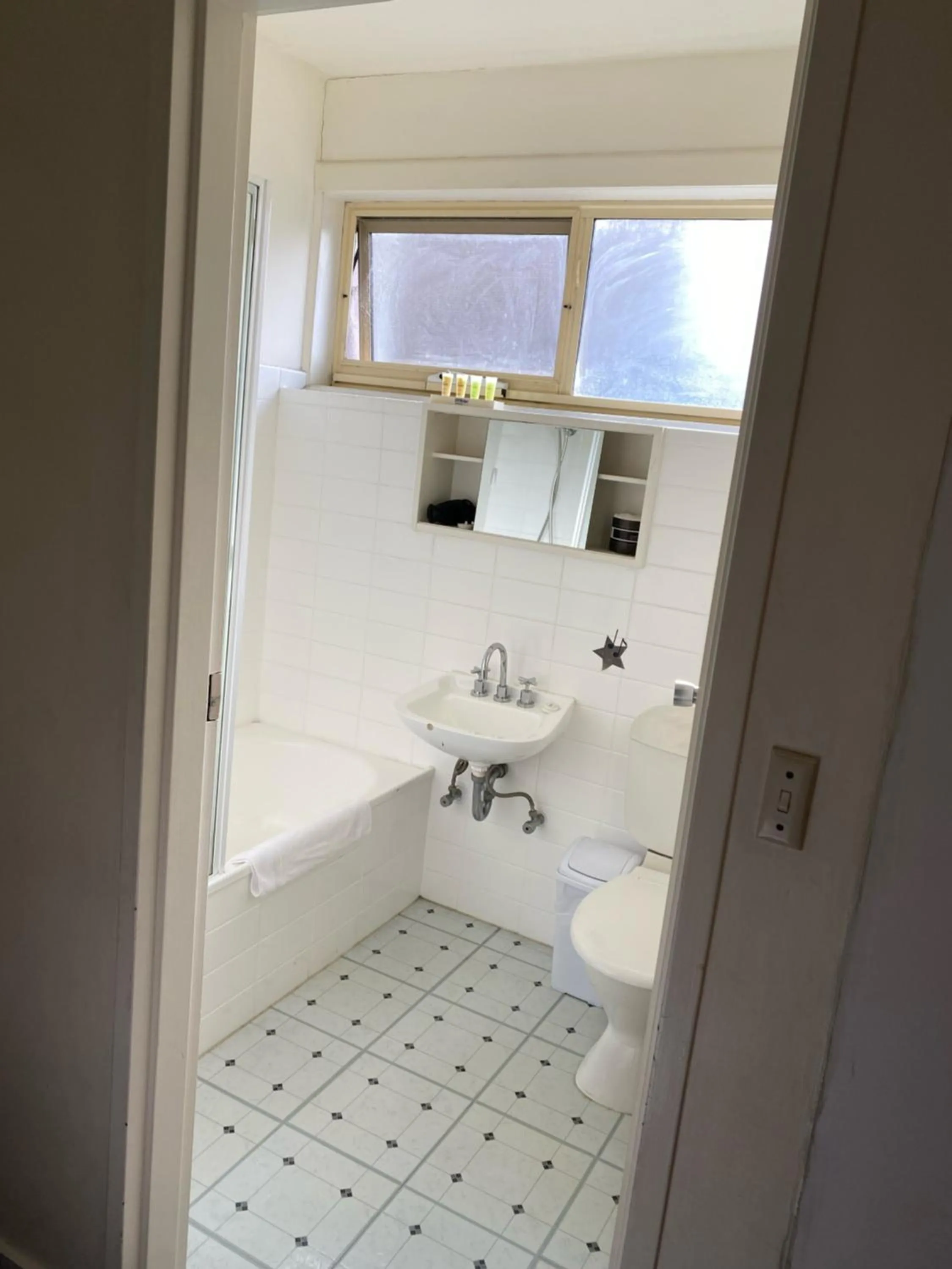 Bathroom in City Edge East Melbourne Apartment Hotel