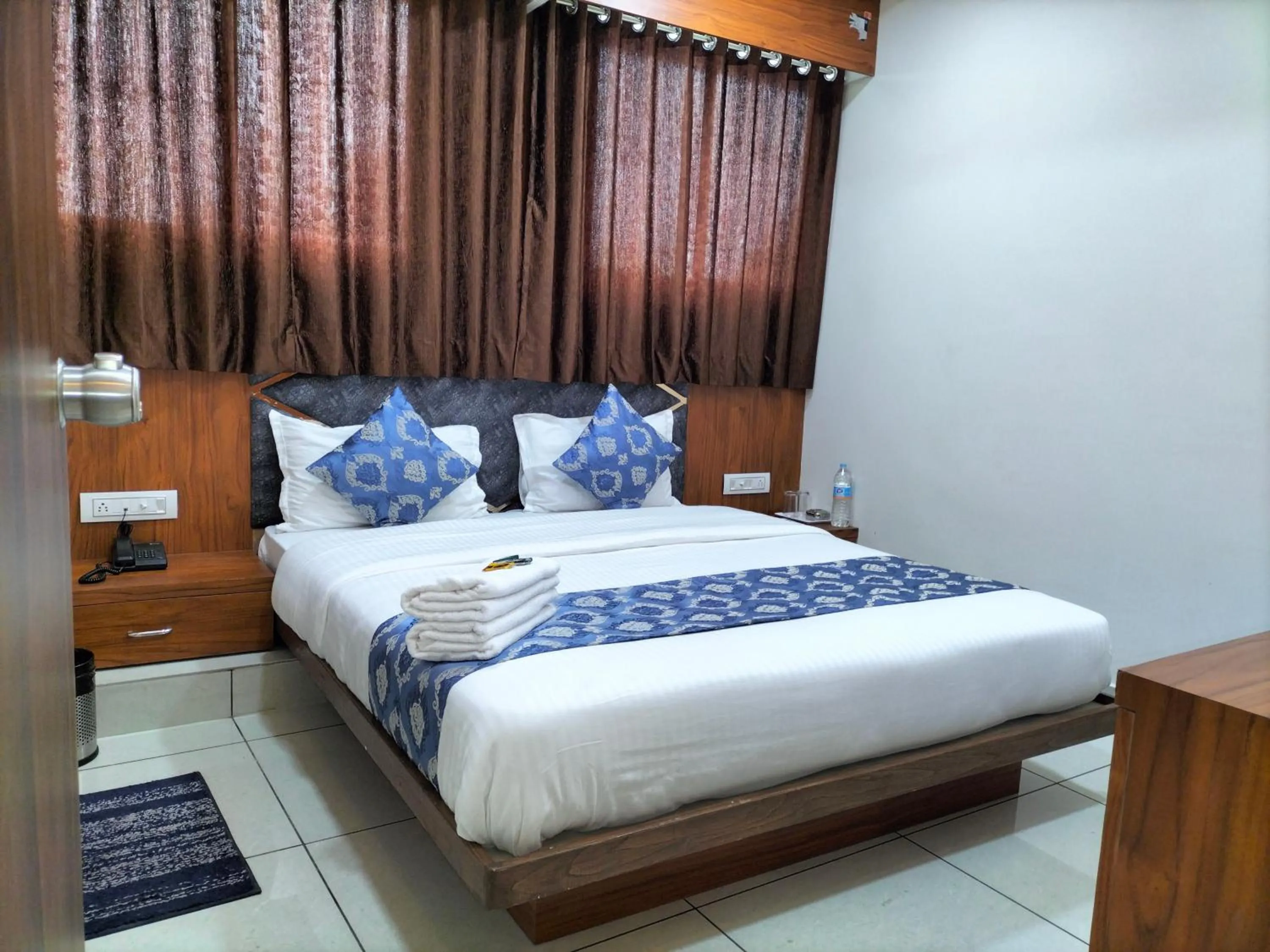 Bed in Hotel Divya Palace
