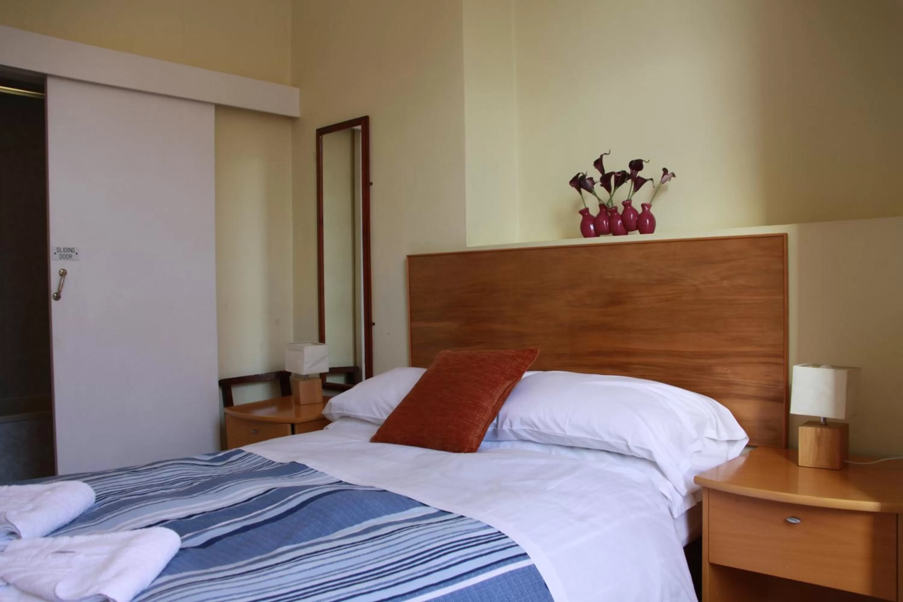 Bed in Ambassador Hotel