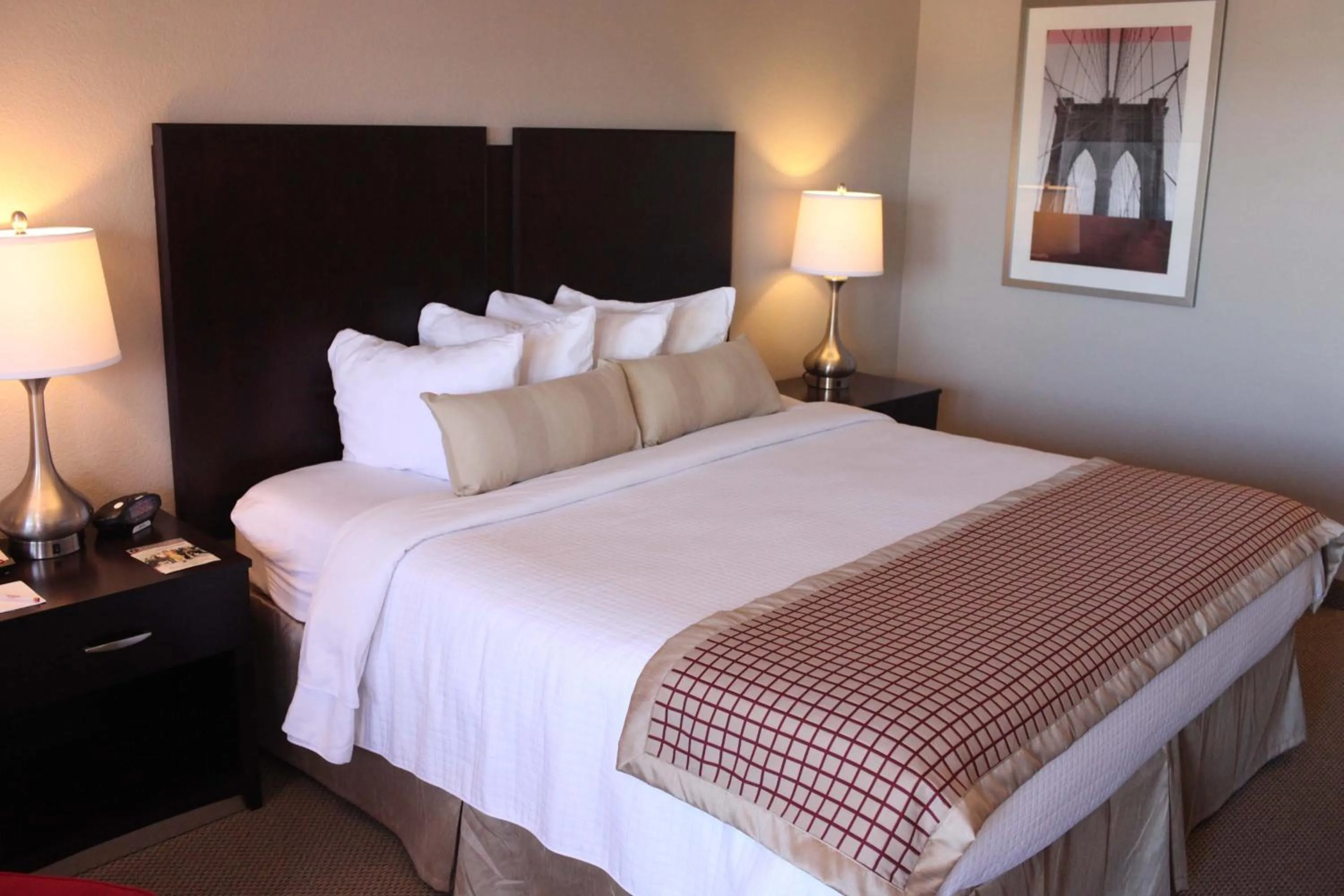 Bed in Infinity Inn & Suites