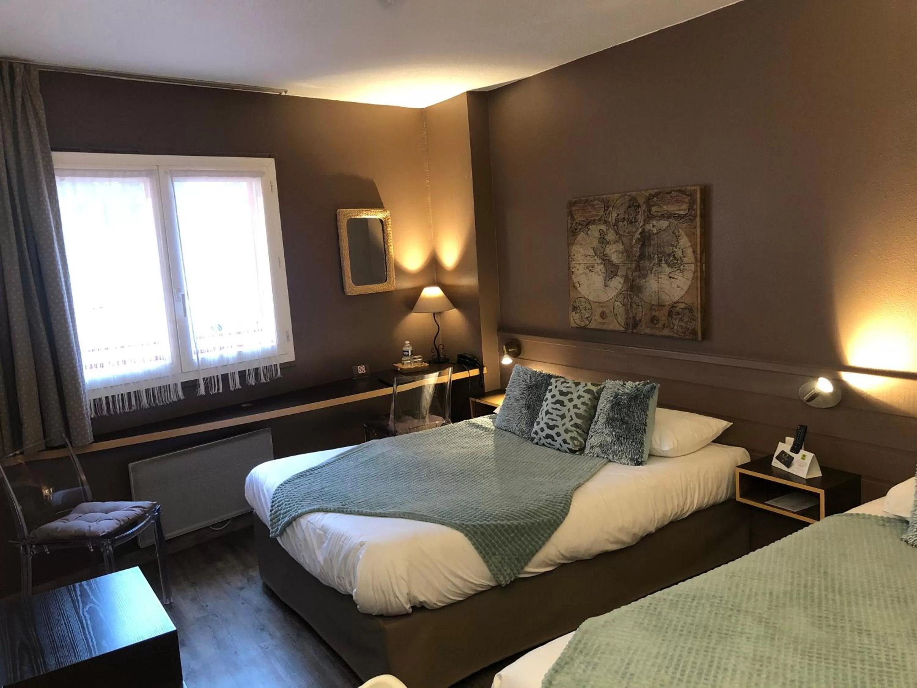 Bed in Logis Hôtel Burnichon