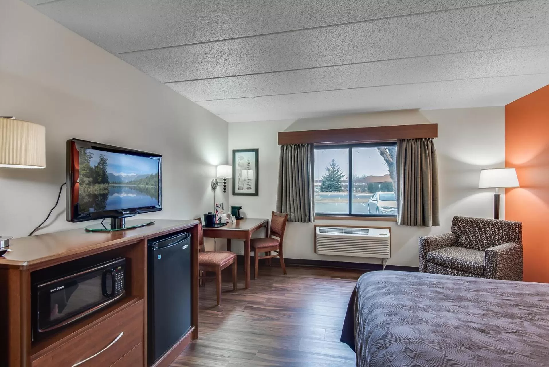 Bed in AmericInn by Wyndham Coon Rapids