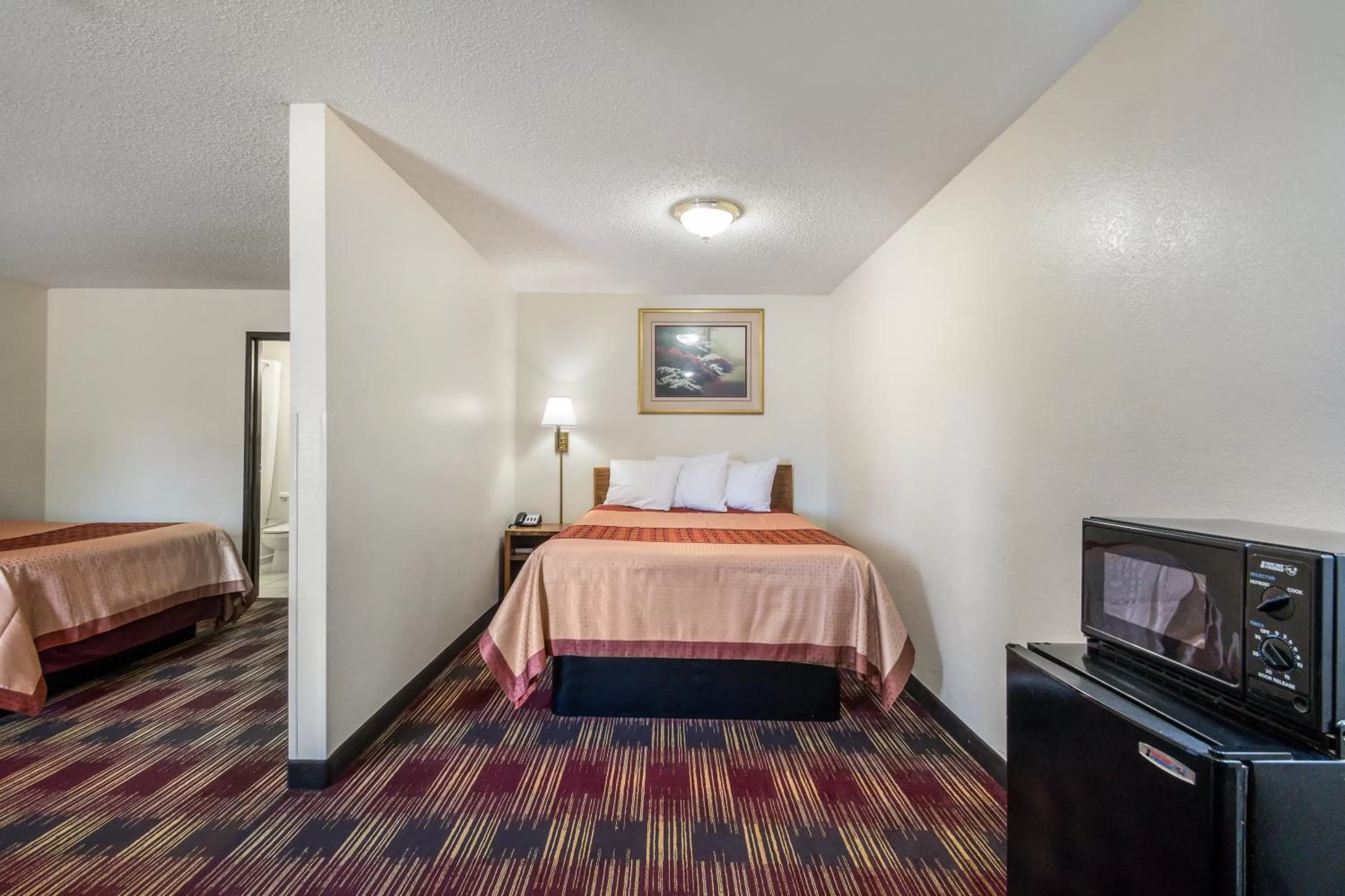 Bed in Americas Best Value Inn & Suites Harrisonville