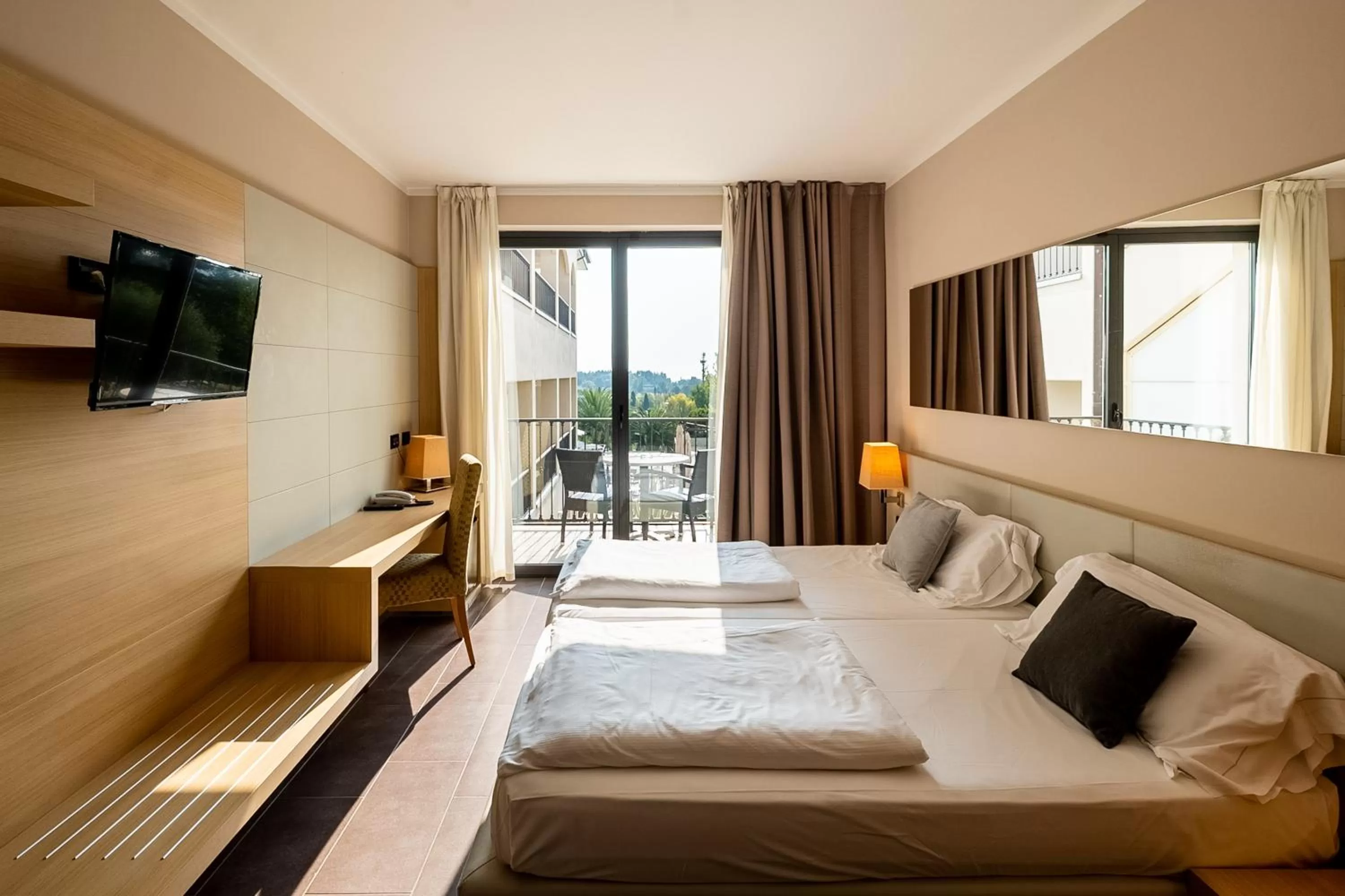 Bed in Villa Luisa Resort & Luxury Apartments