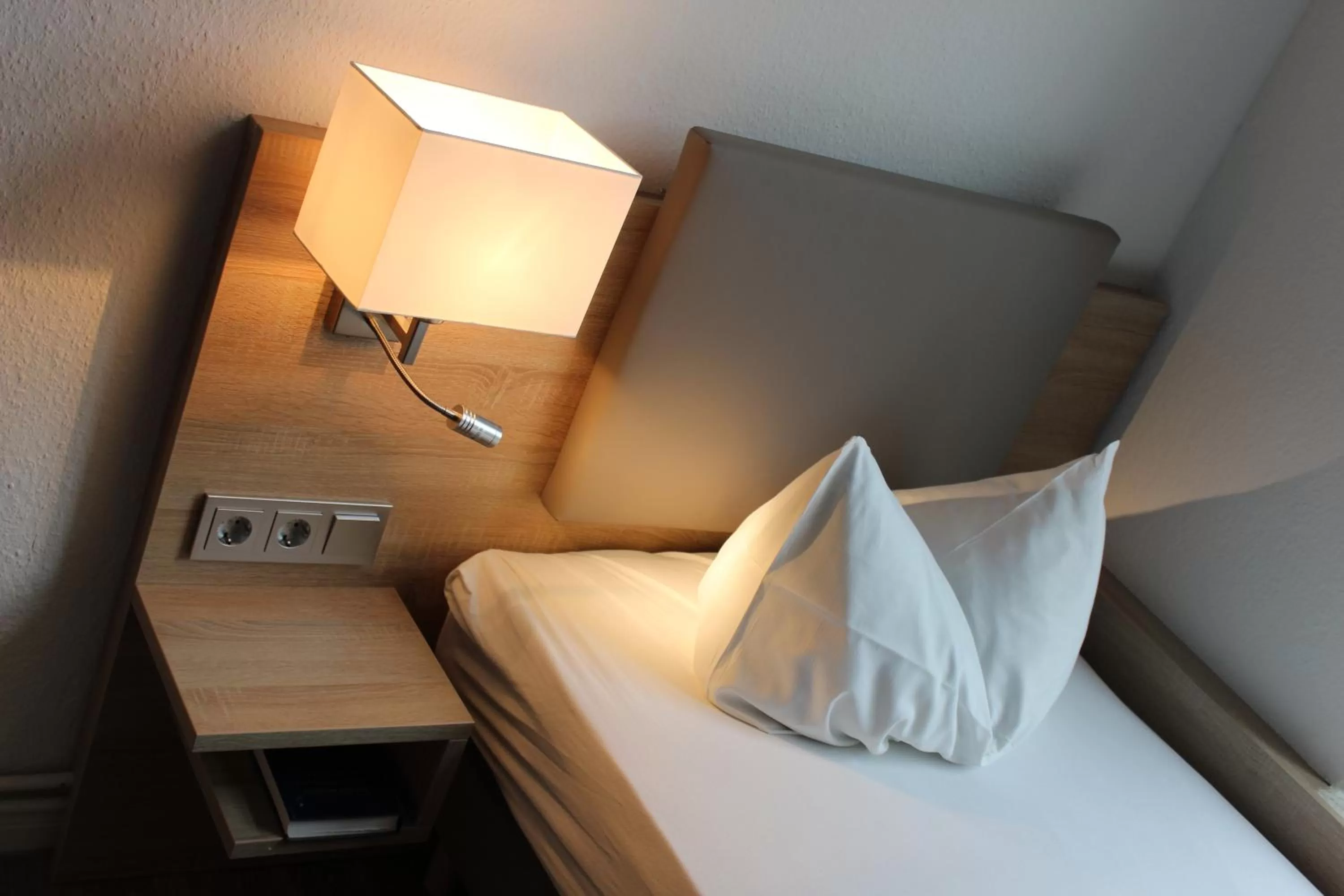 Bed in Stadthotel-Garni Smutje