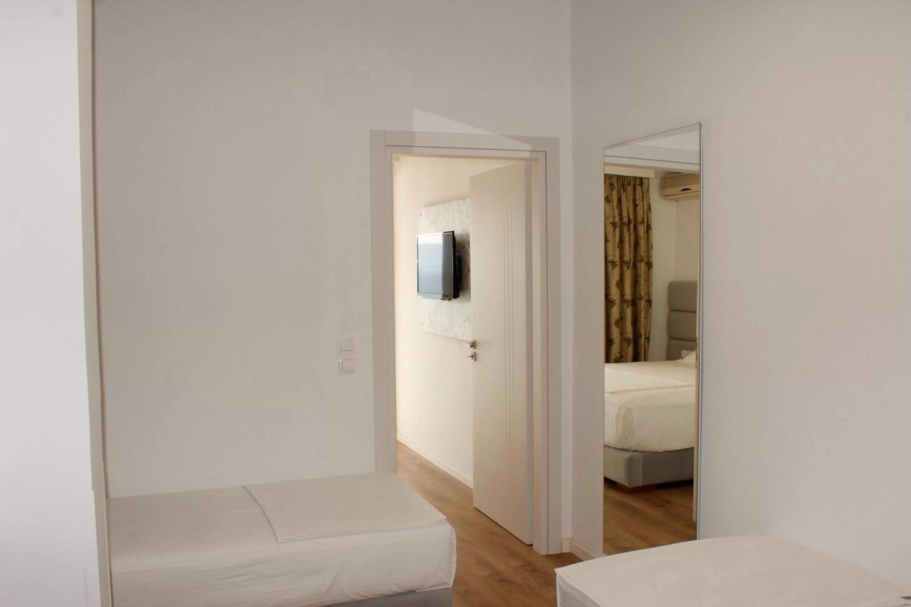 Bed in Murati Suites Sarandë