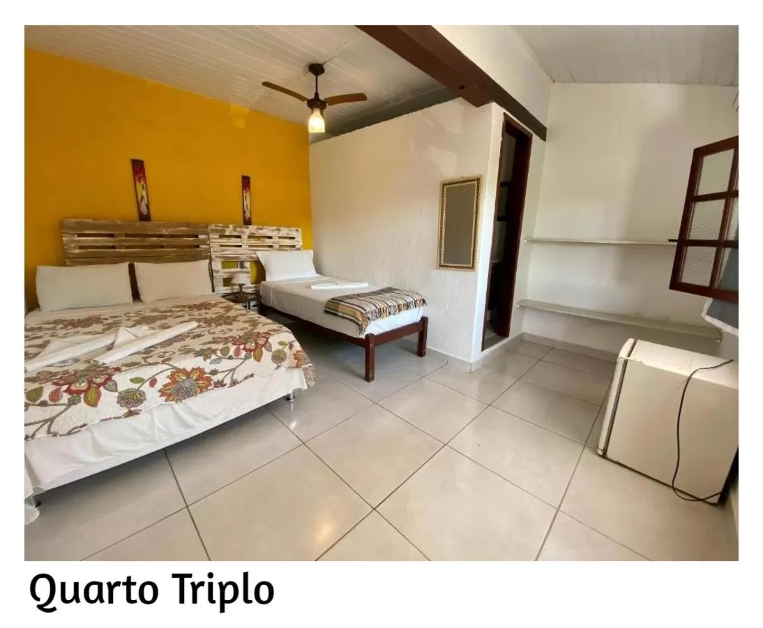 Photo of the whole room, Bed in Pousada Porto Búzios