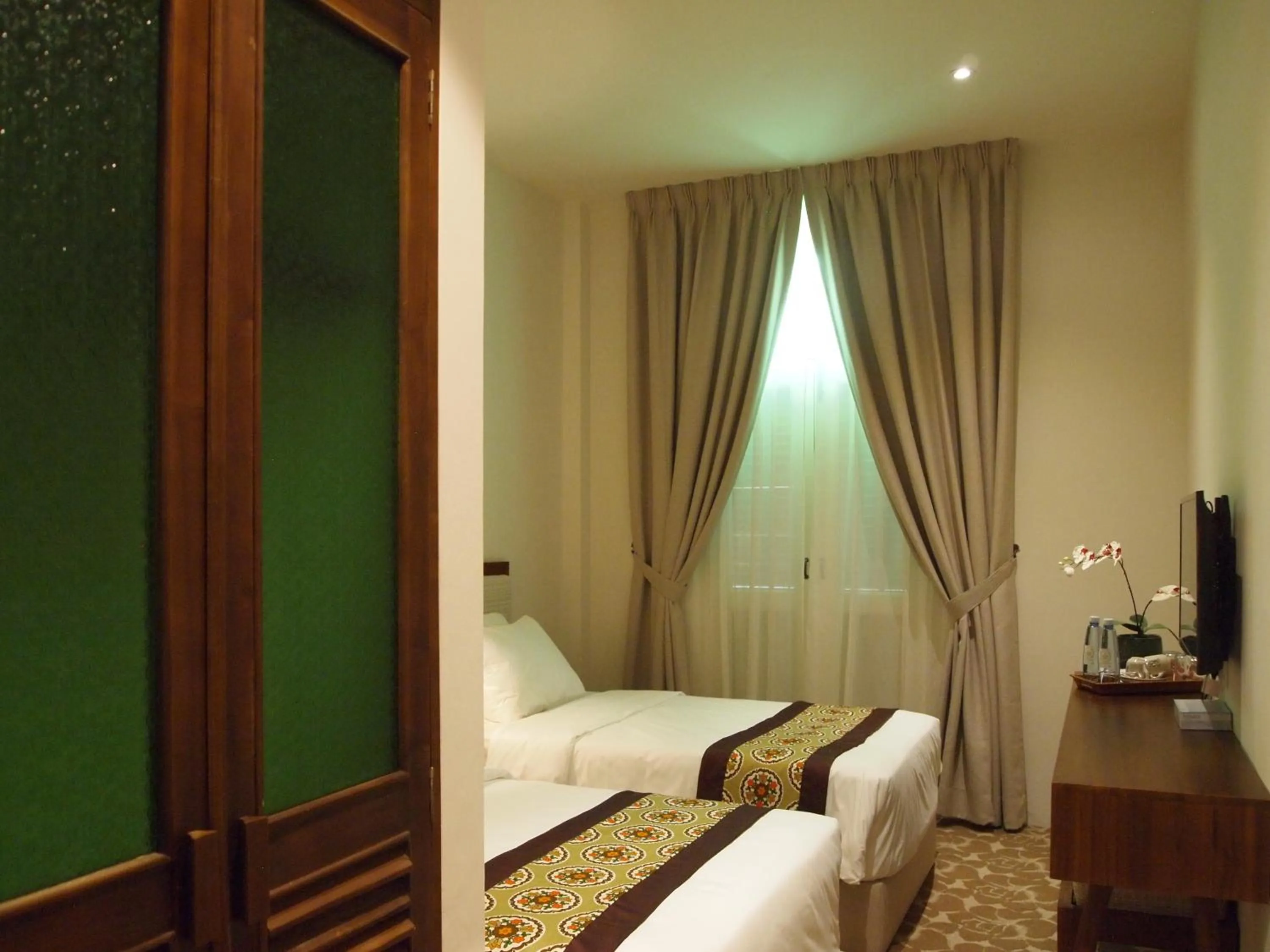 Bed in Kapitan Kongsi Boutique Hotel