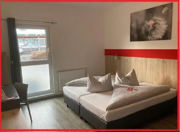 Photo of the whole room, Bed in Hotel Hohenloher Tor