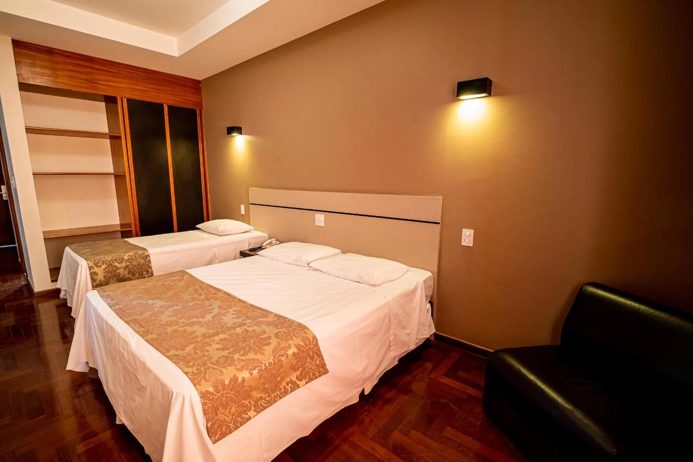 Bed in Serrano Residencial Hotel